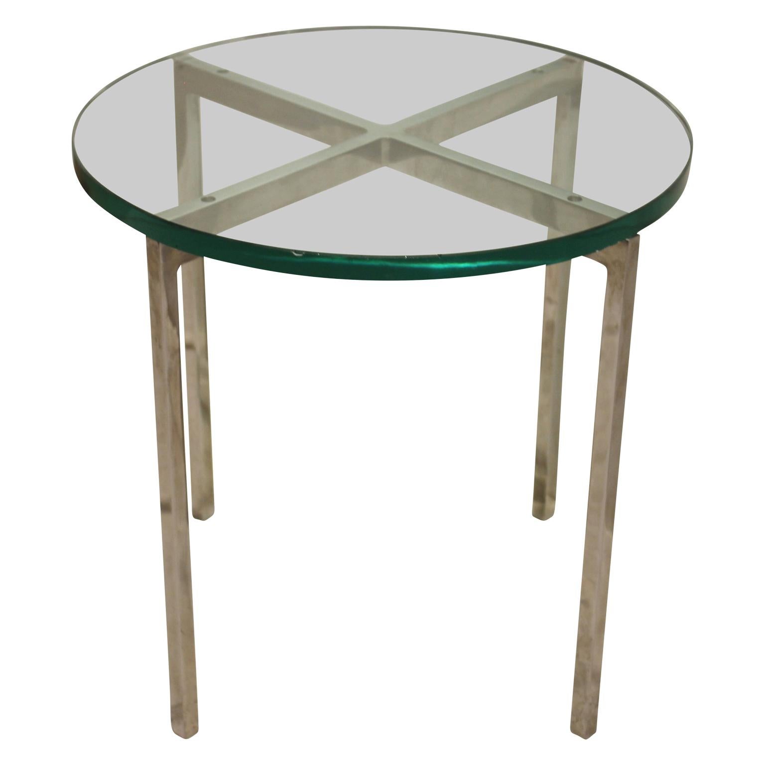 Pair of beautiful side tables with a stainless steel frame and a thick glass top. Beautiful, Minimalist design by Nicos Zographos.