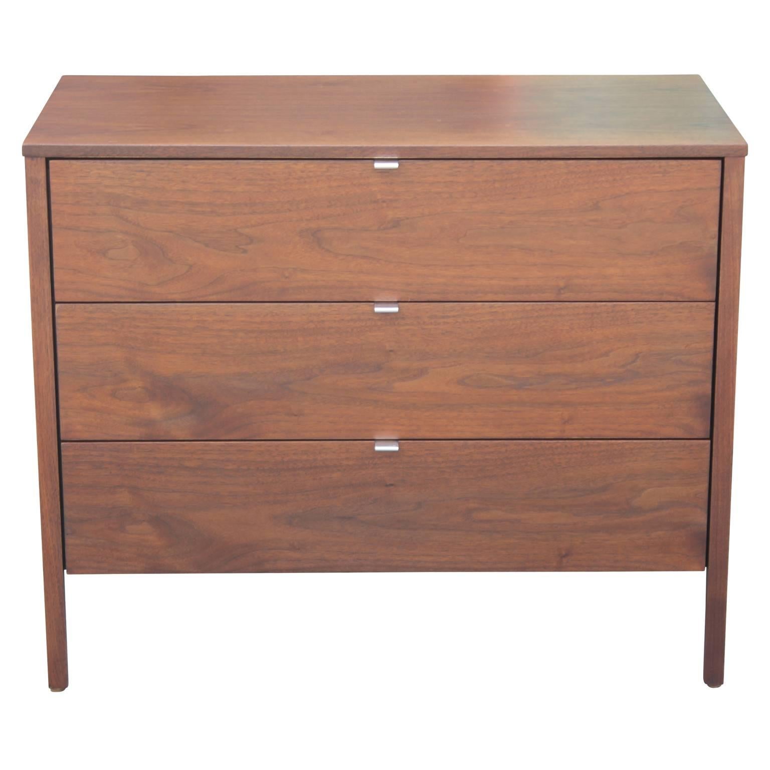Pair of Mid-Century Modern clean-lined walnut Bachelor's chests by Knoll. Freshly refinished. One chest contains four drawers while the other contains three drawers.