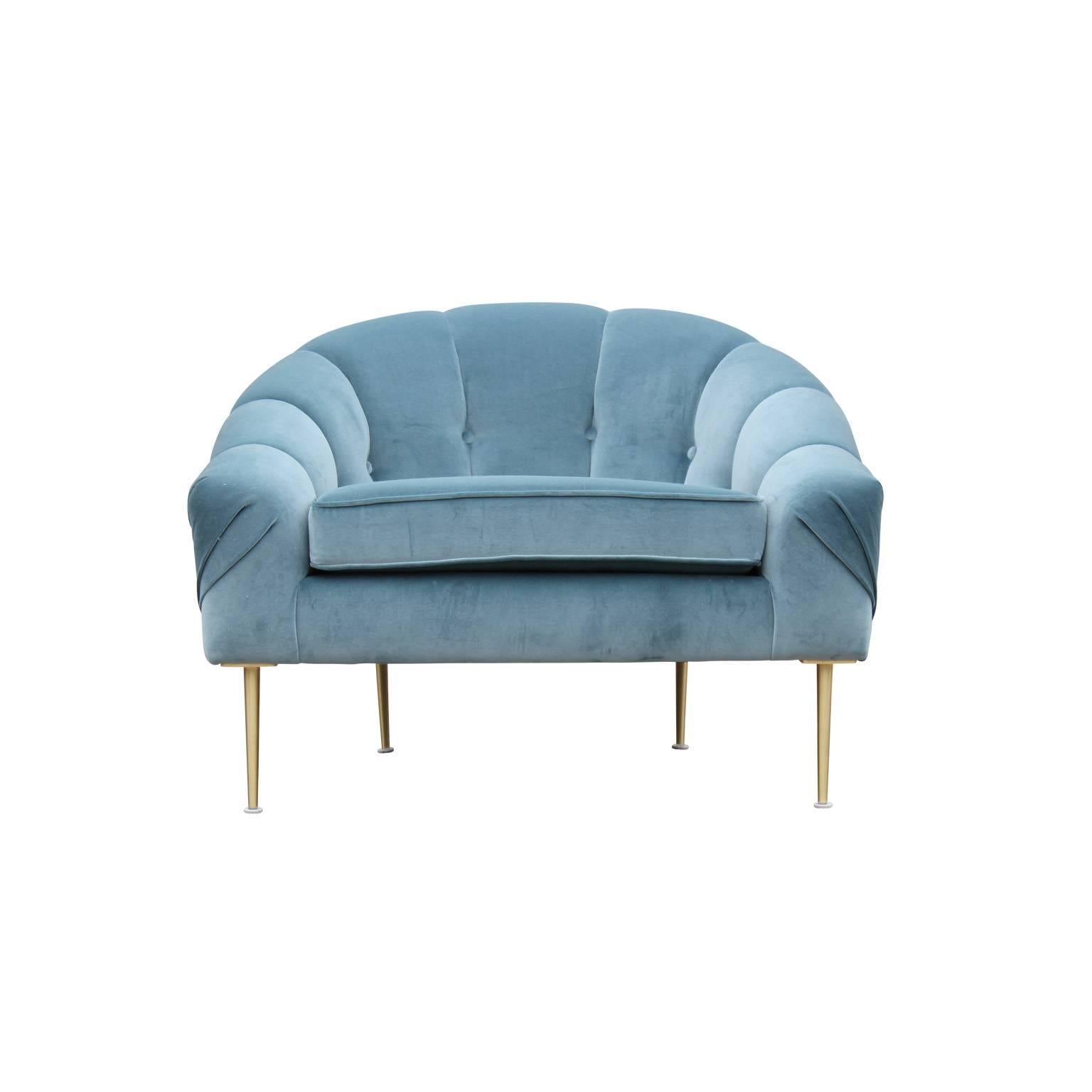 Pair of gorgeous custom made blue velvet lounge chairs with tapered brass legs. In the style of Ward Bennett or Milo Baughman. Freshly upholstered in a cool blue velvet. The perfect chair.