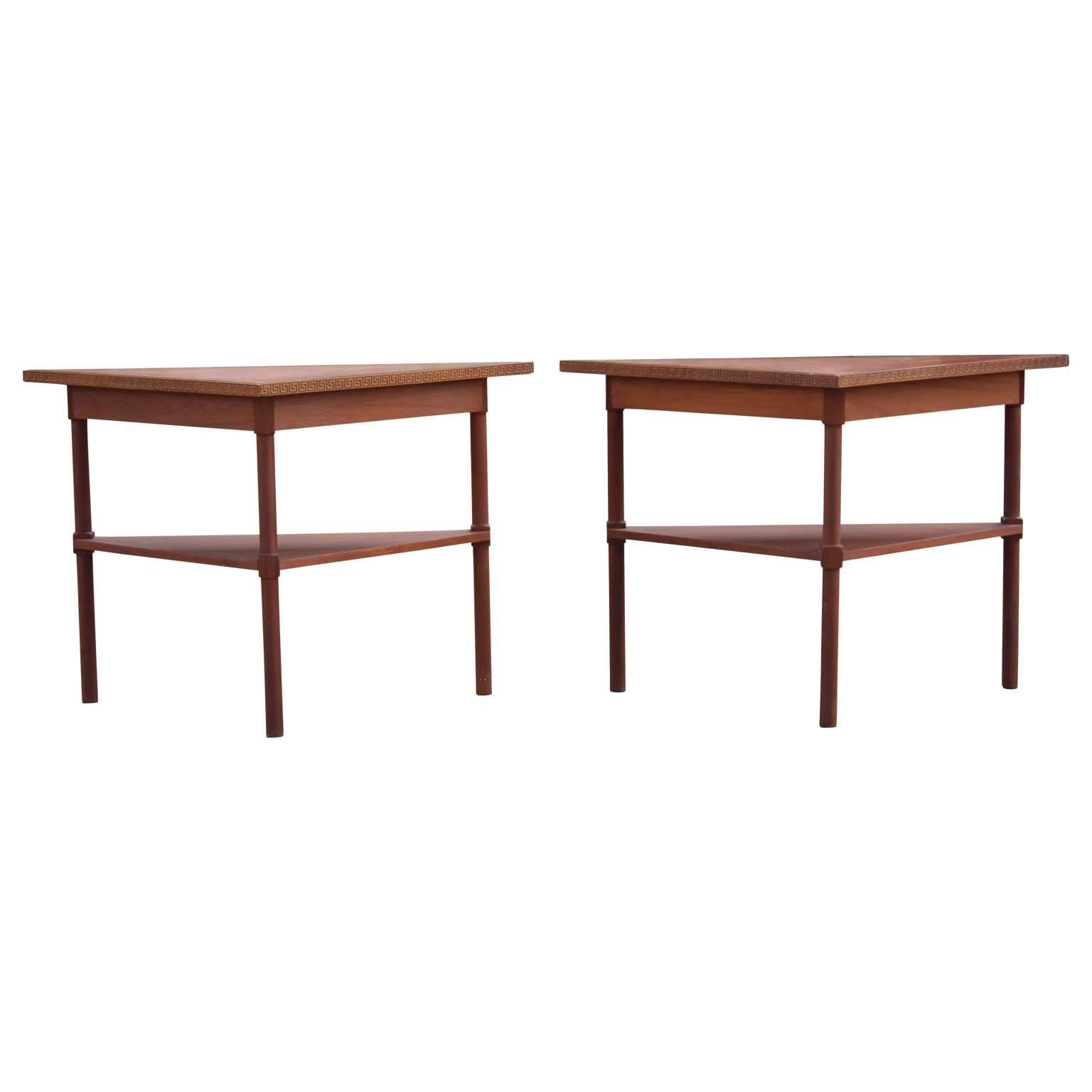 Unique pair of custom-made two-tiered entry way / end tables made from walnut and featuring a carved Greek key patterned trim. Can also be pushed together to make a single table.