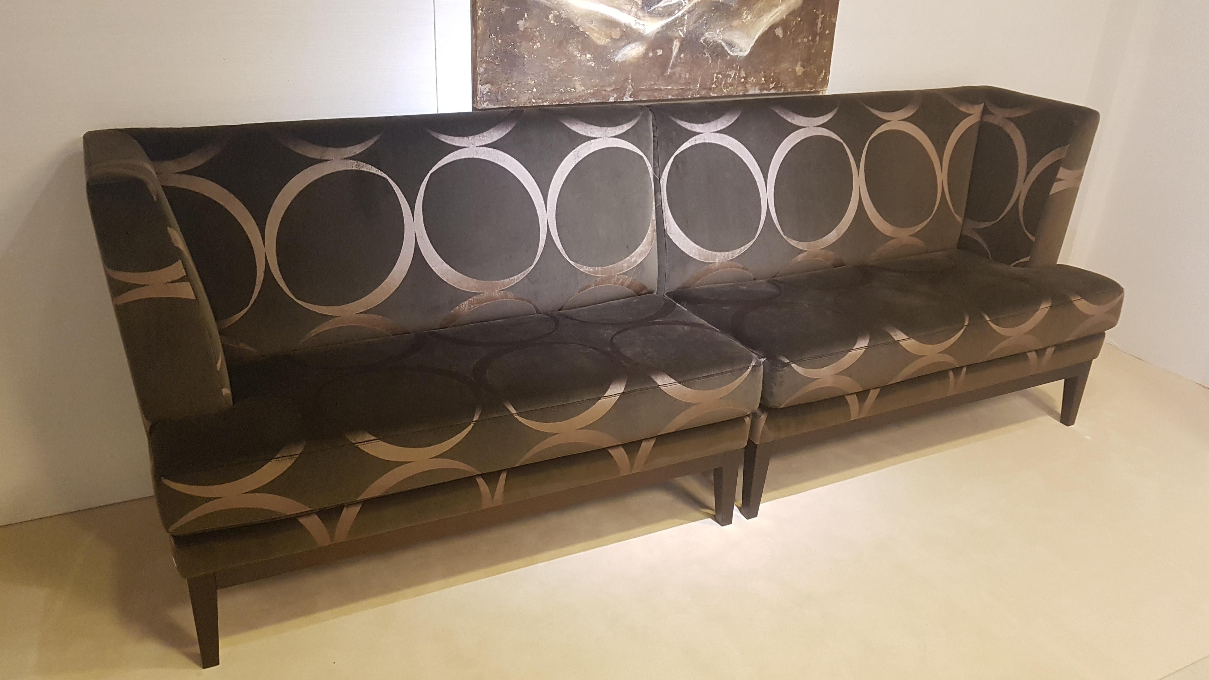 A luxurious pair of modern design benches covered with a high end velor fabric. They feature an elegant and shiny gold and brown color with dark brown wenge wood feet. Symmetrical benches with a cornered backrest on each side. Handmade German