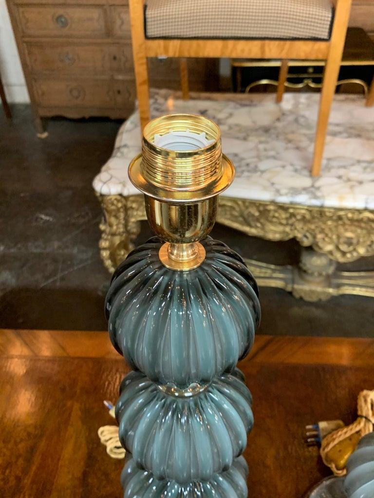 Exquisite pair of modern Murano double blown glass lamps. Beautiful blue grey color with gold highlights in between each section. Wired and ready to install. Very fine quality!
