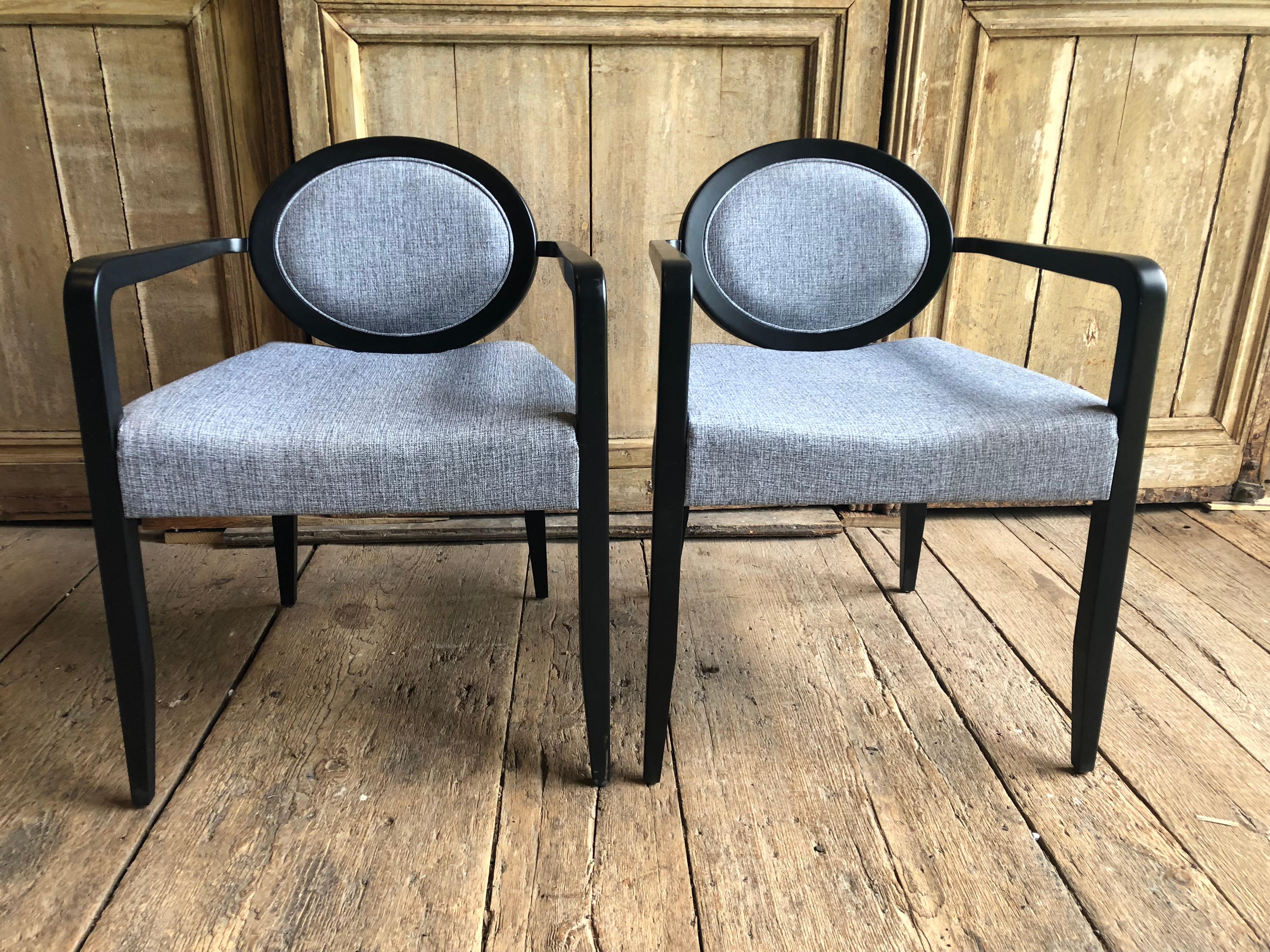 A pair of ultra modern “Elizabetha” armchairs in satin black lacquer finish manufactured by Capdell Furniture in Spain.