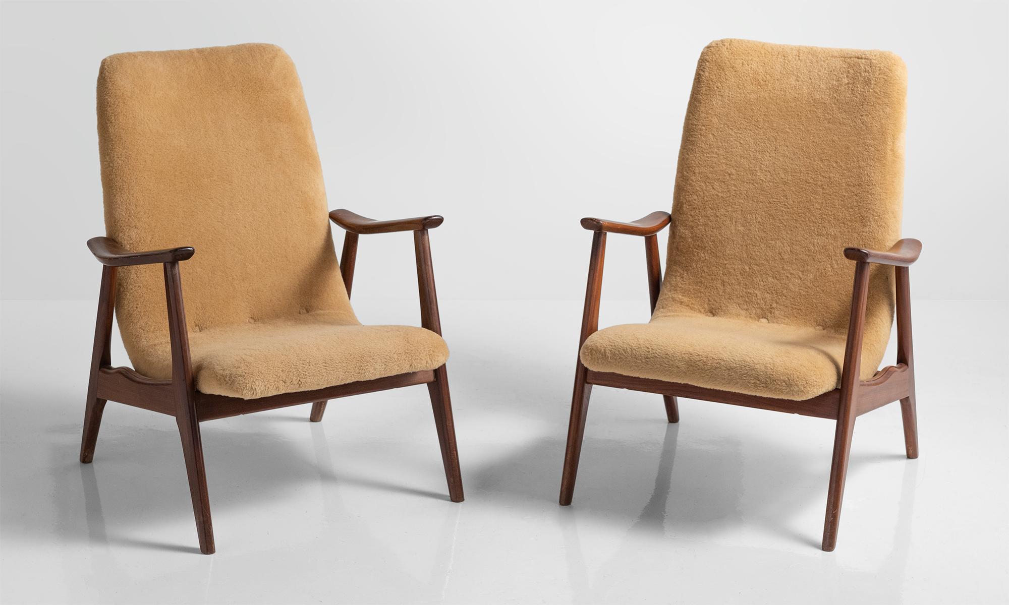 Pair of modern sheepskin armchairs, Sweden, circa 1950.

Pair of Scandinavian forms with teak frame and original sheepskin upholstery.