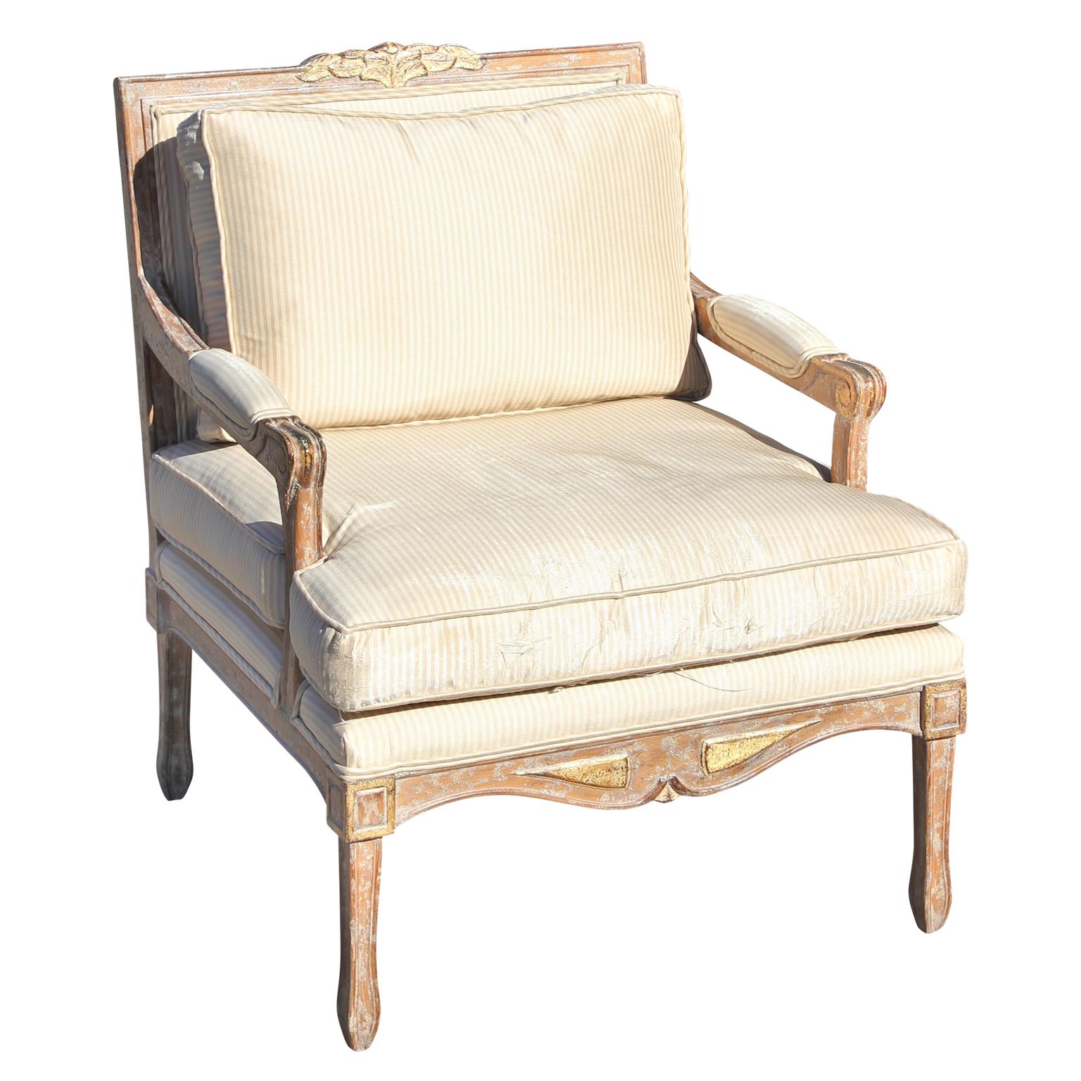Great pair of modern style French lounge chairs made by Kreiss. The fabric has a few blemishes, for perfection new upholstery os recommended. This is something that we can do for you. The carved details has a touch of gold. Excellent quality and