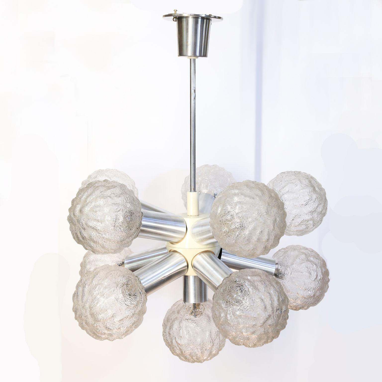 Pair of modern German flush-mount fixtures with eleven lights each. These fun Sputnik-like flush-mounts have Limburg glass shades.  They are comprised of painted metal, chrome, and hand-blown glass. These are Mid-Century Modern lamps that are a bit