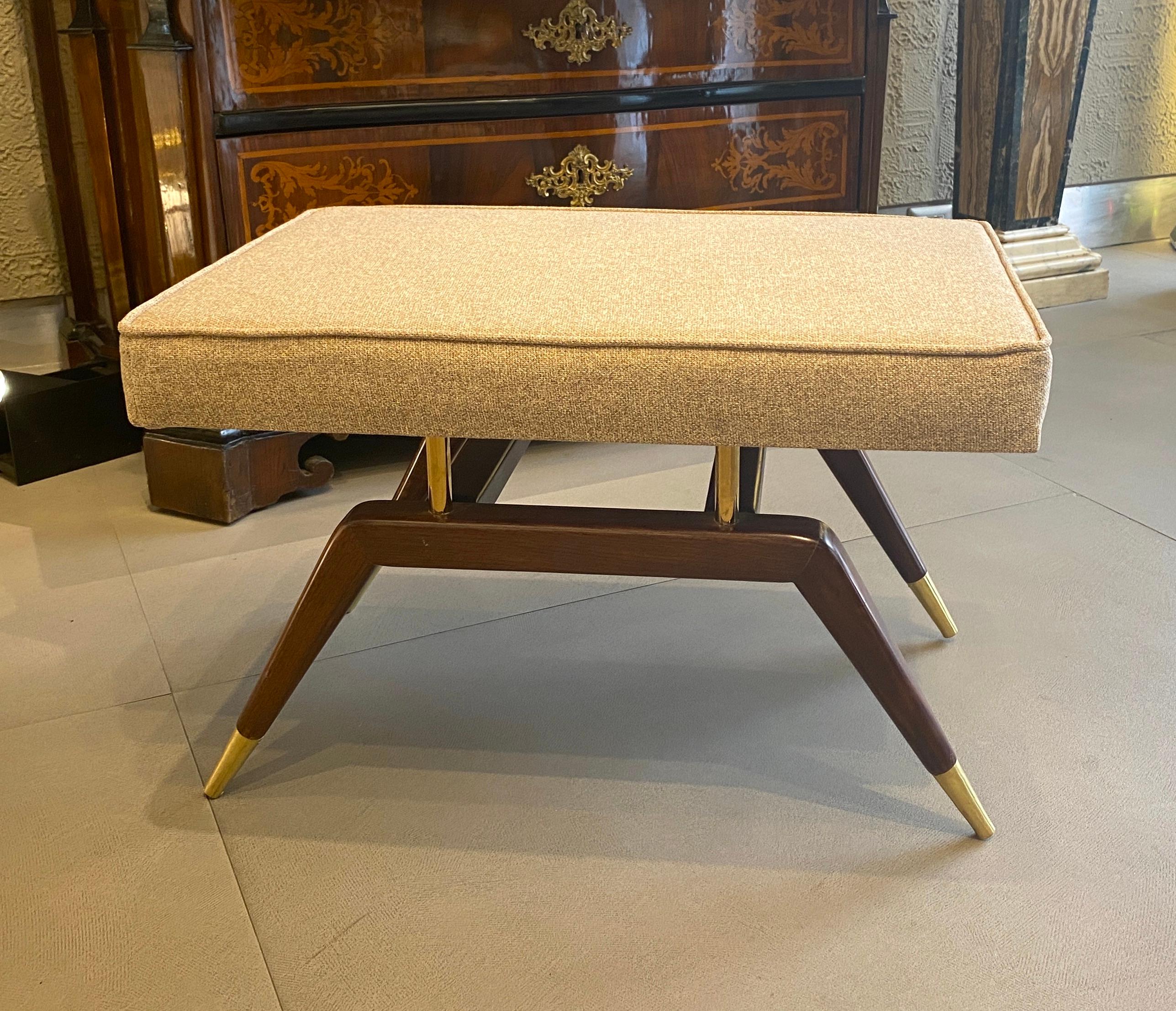 Pair of Modern walnut sculpted and brass sabot benches or settees inspired by Gio Ponti the famous Italian Mid - Century designer .
Floating cushion newly upholstered  on top of solid brass pillars and hangs over a narrow frame. 
 
