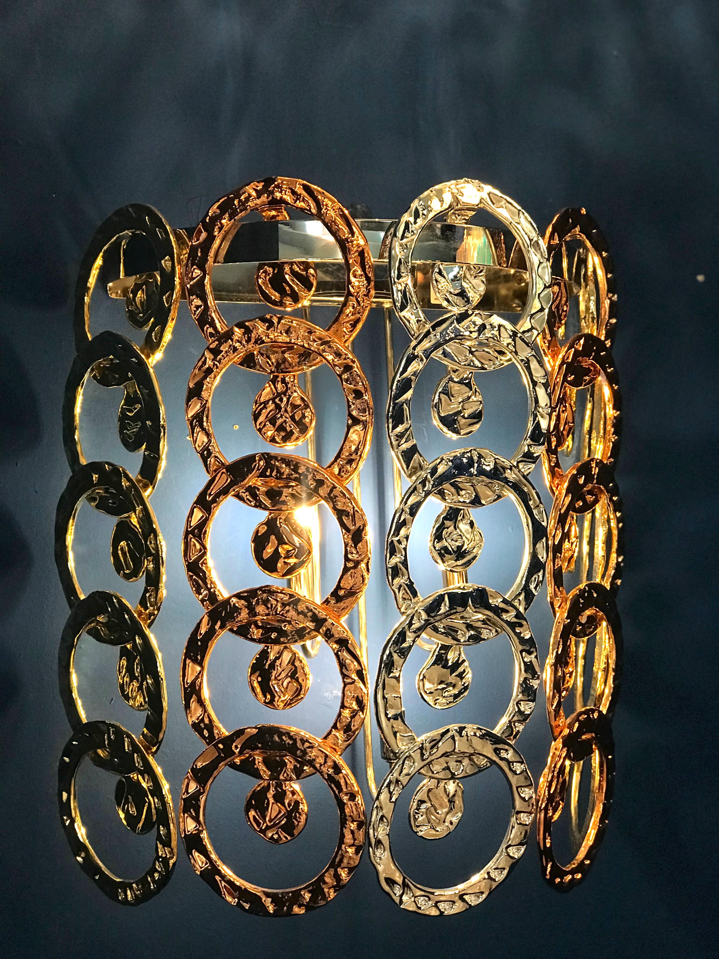 Striking pair of Murano glass Giogali sconces with gold, silver and copper color handmade glass links hanging on chrome frame.
 Available aslo a chandelier or ceiling light. 
Great decoration with outstanding light effect by Veneziani Arte .
3 x G9
