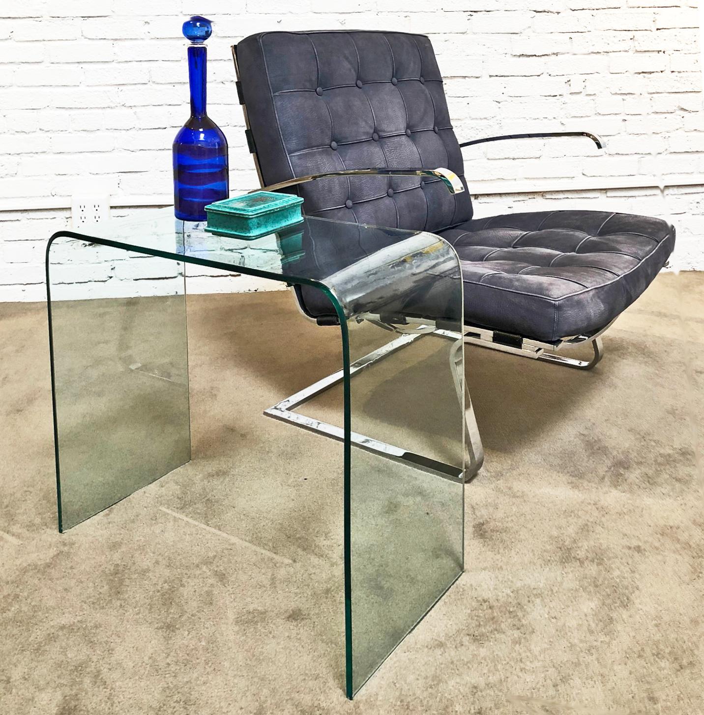 Pair of modern glass side tables. Bent clear glass. Price is for the pair.