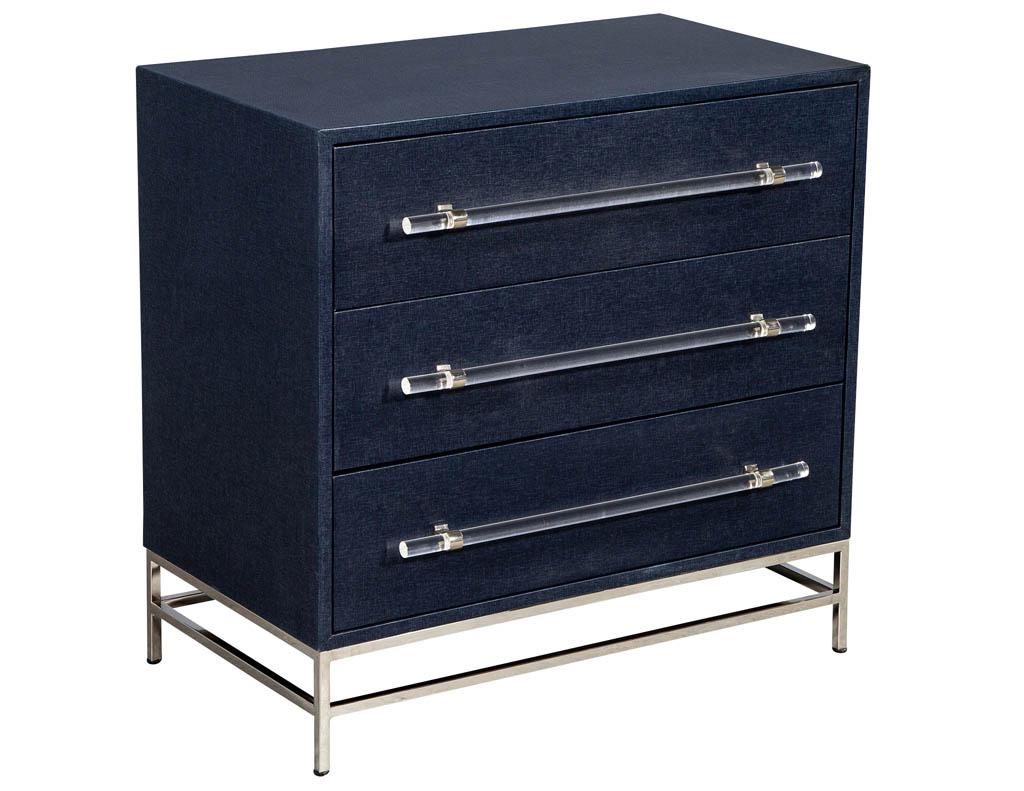 Pair of modern indigo chest of drawers. Featuring navy indigo lacquered linen finish. With elegant acrylic handles and polished nickel details.

Price includes complimentary scheduled curb side delivery service to the continental USA.