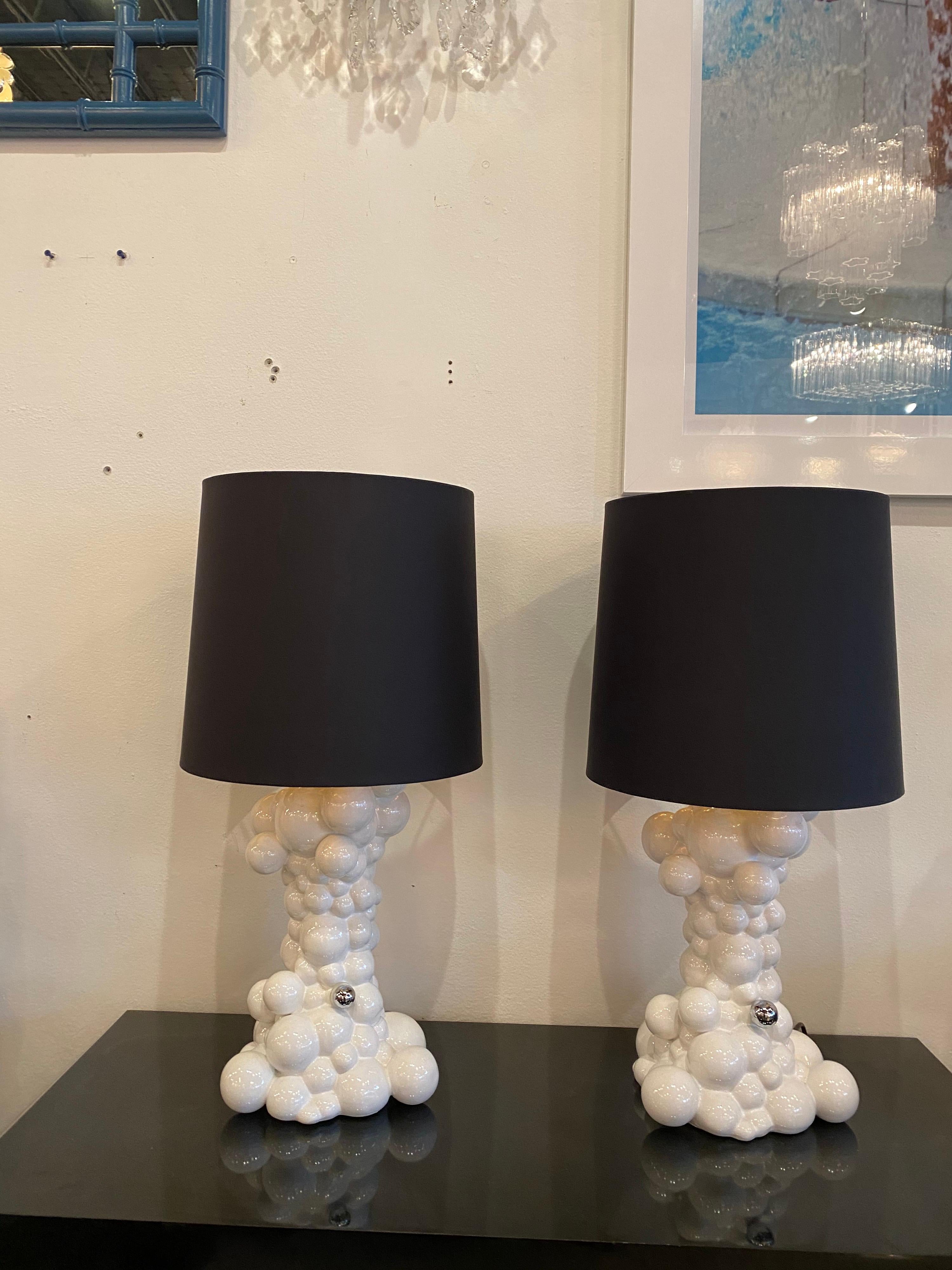 Pair of 21st century ceramic bubbles ball table lamps. The silver ball is a touch turn, 3 way.  No chips or breaks. Lamps measure 18