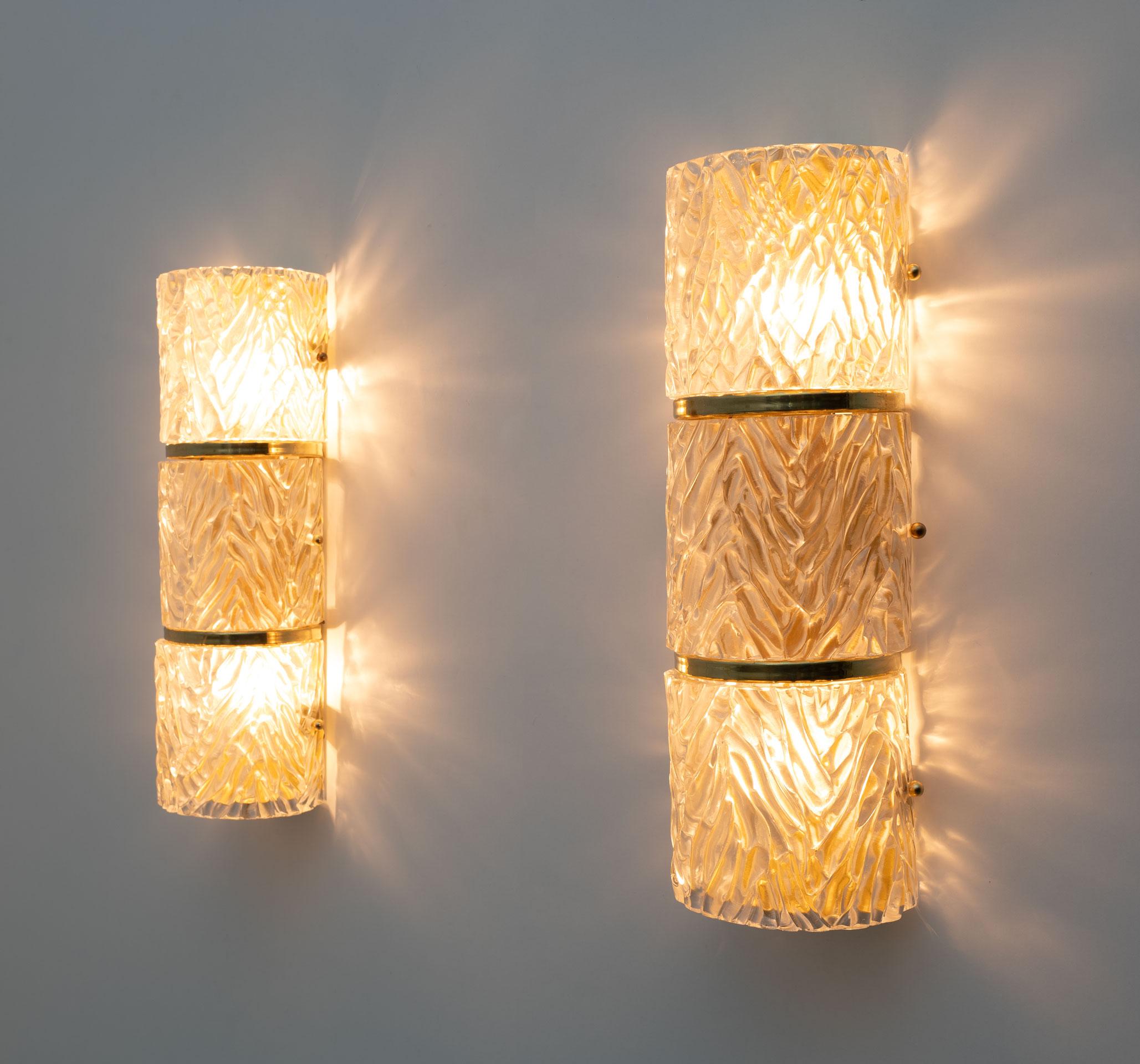 Pair of vintage Italian Murano glass sconces, produced by the Masters of Murano, each with two pieces of curved 