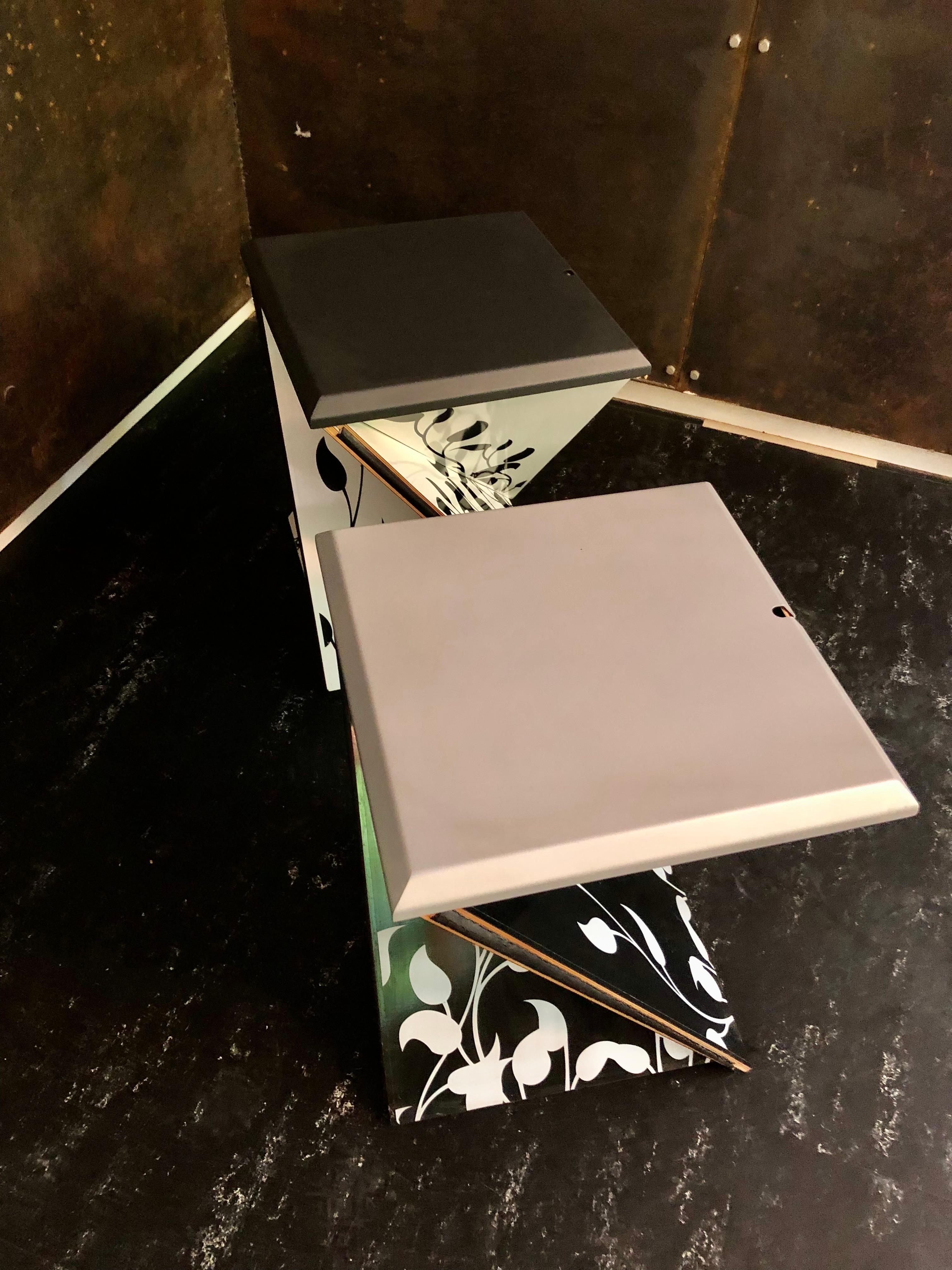Danese Milano Kada foldable stool / side table designed by Yves Behar. To use as a stool or side table, top or seat is removable and can be used as a tray. It is made of black and white  laminated birch wood, black metal leaf / seat with a fashion