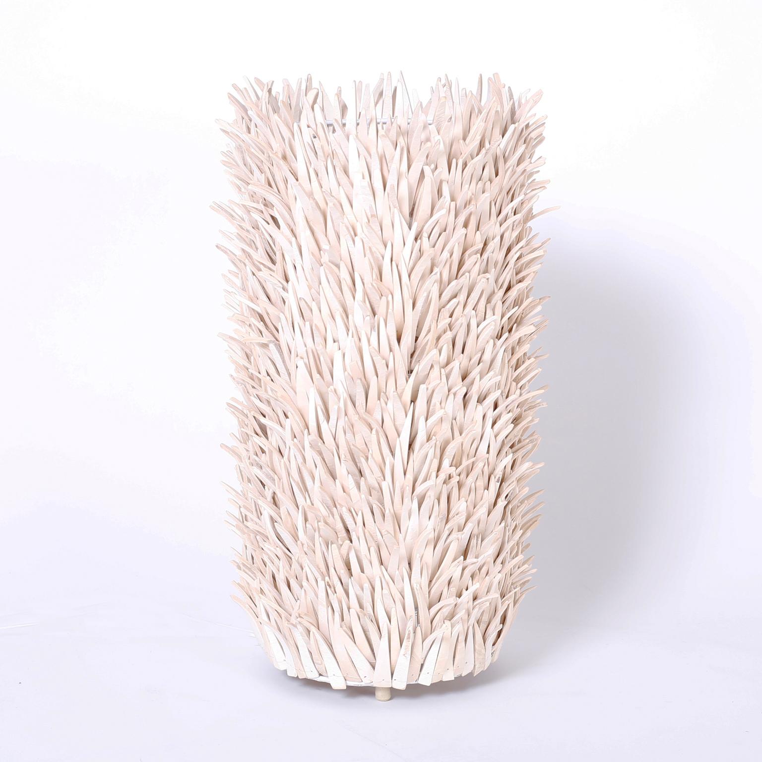 Unique pair of table lamps crafted with leather strips over a metal frame, having a strong reference to organic fauna and flora or sea urchins.
