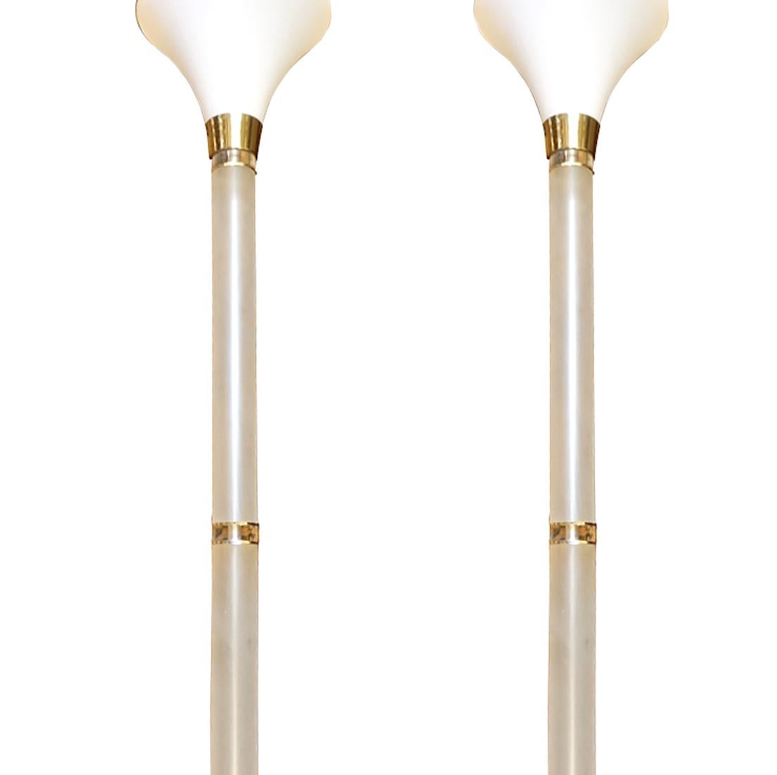 A pair of circa 1950s French Lucite torchiere floor lamps with glass shades.

Measurements:
Height 60