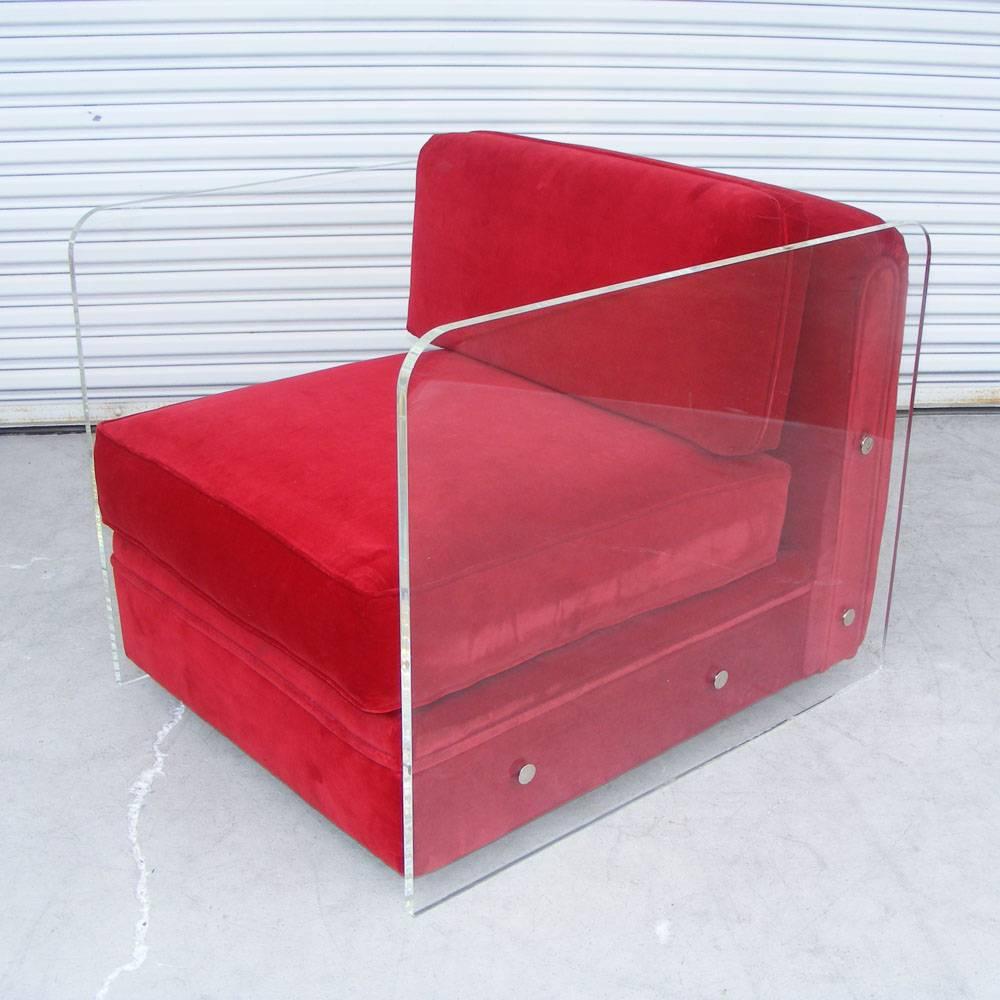 Two custom-designed armchairs with Lucite frames and richly upholstered in 
red velvet. Chrome end caps.