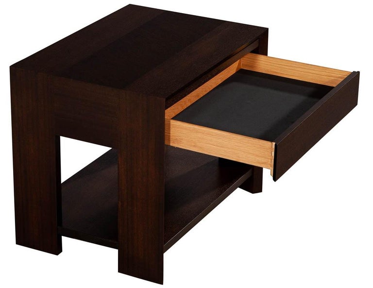 Pair of modern mahogany end tables. Sleek design in mahogany wood finished in a rich espresso stain finish. Features pull out tray above drawer.

Price includes complimentary scheduled curb side delivery service to the continental USA.