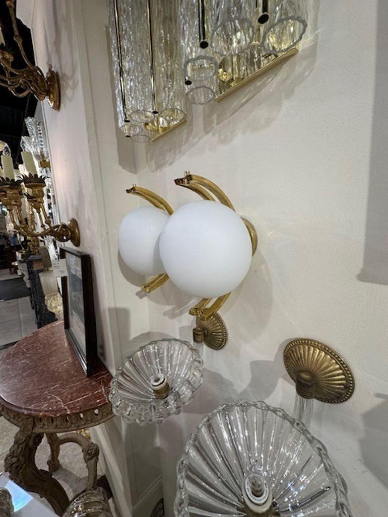 Lovely pair of Modern Murano glass and brass ball form sconces in matte white. Note: Custom colors available.