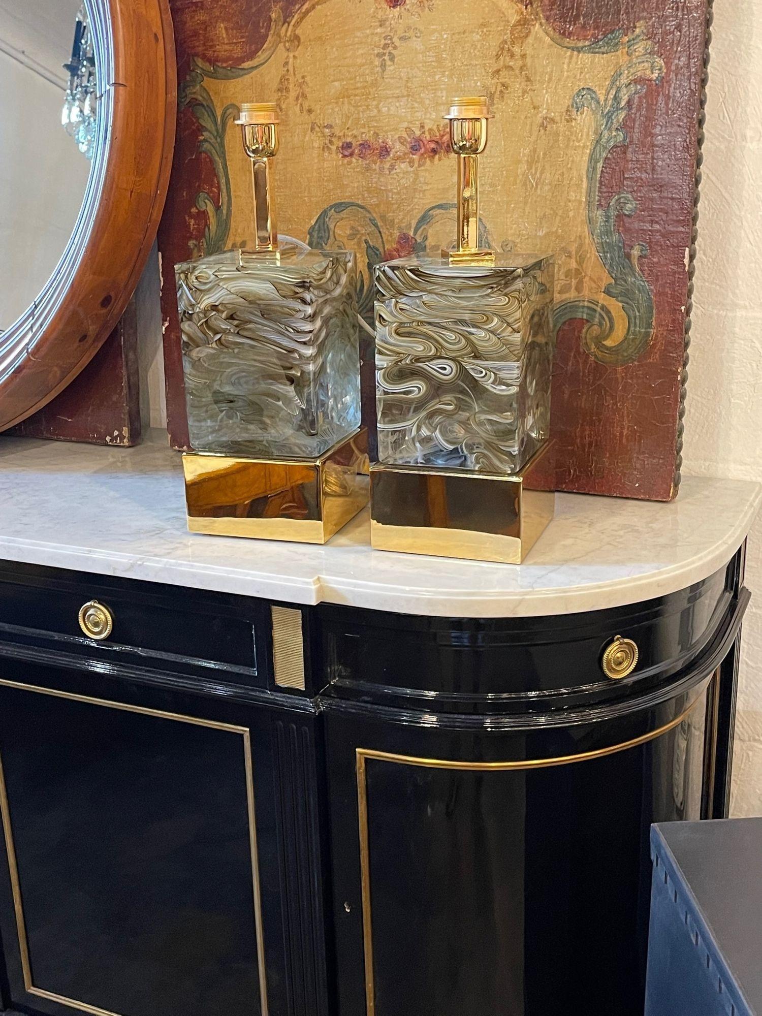 Stylish pair of modern Murano glass and brass lamps. Very heavy piece of glass with brown and white colors. So much depth and movement in this piece. Amazing!