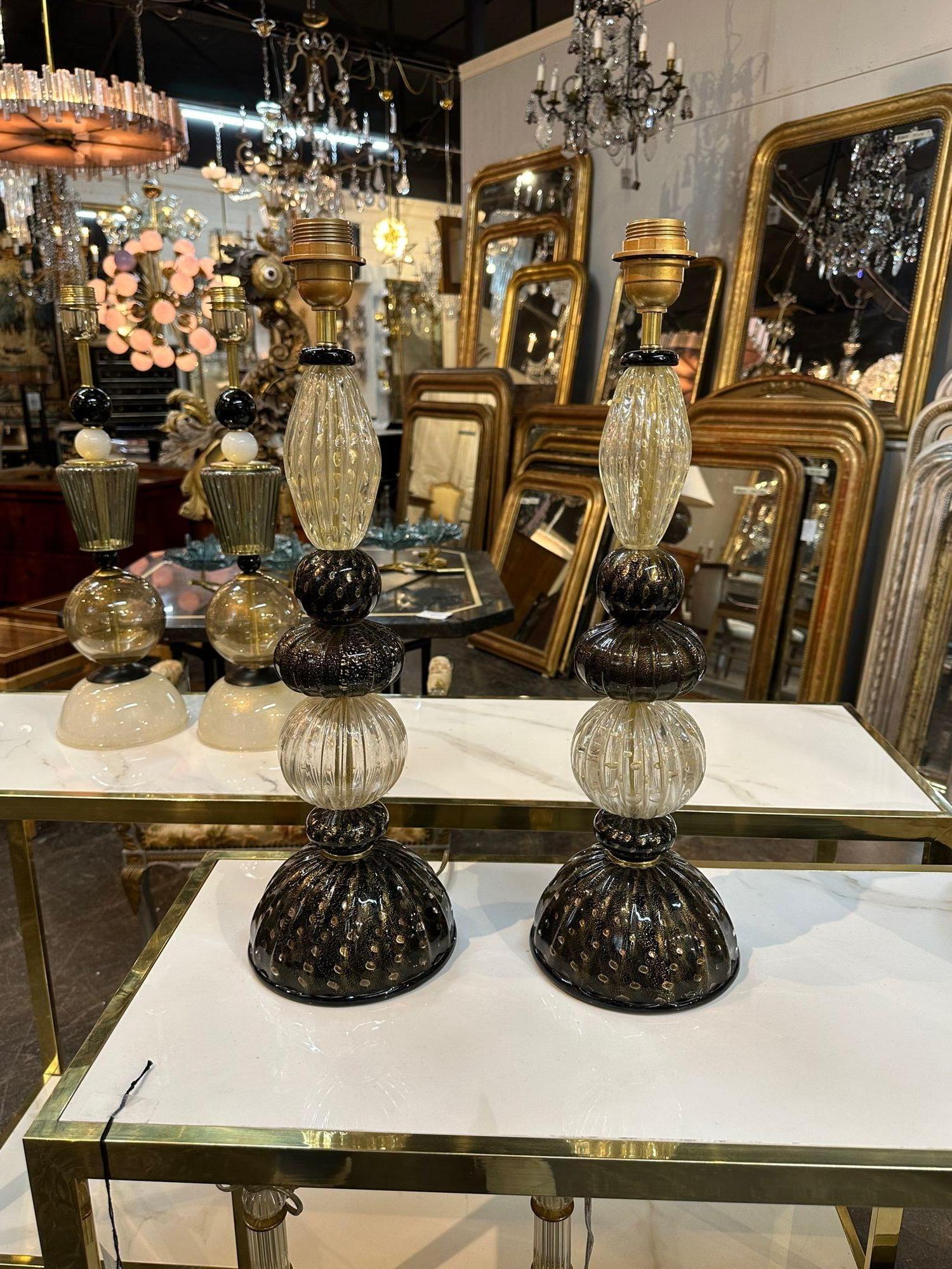Handsome pair of modern black and gold Murano glass lamps. A beautiful decorative element for a fabulous home!