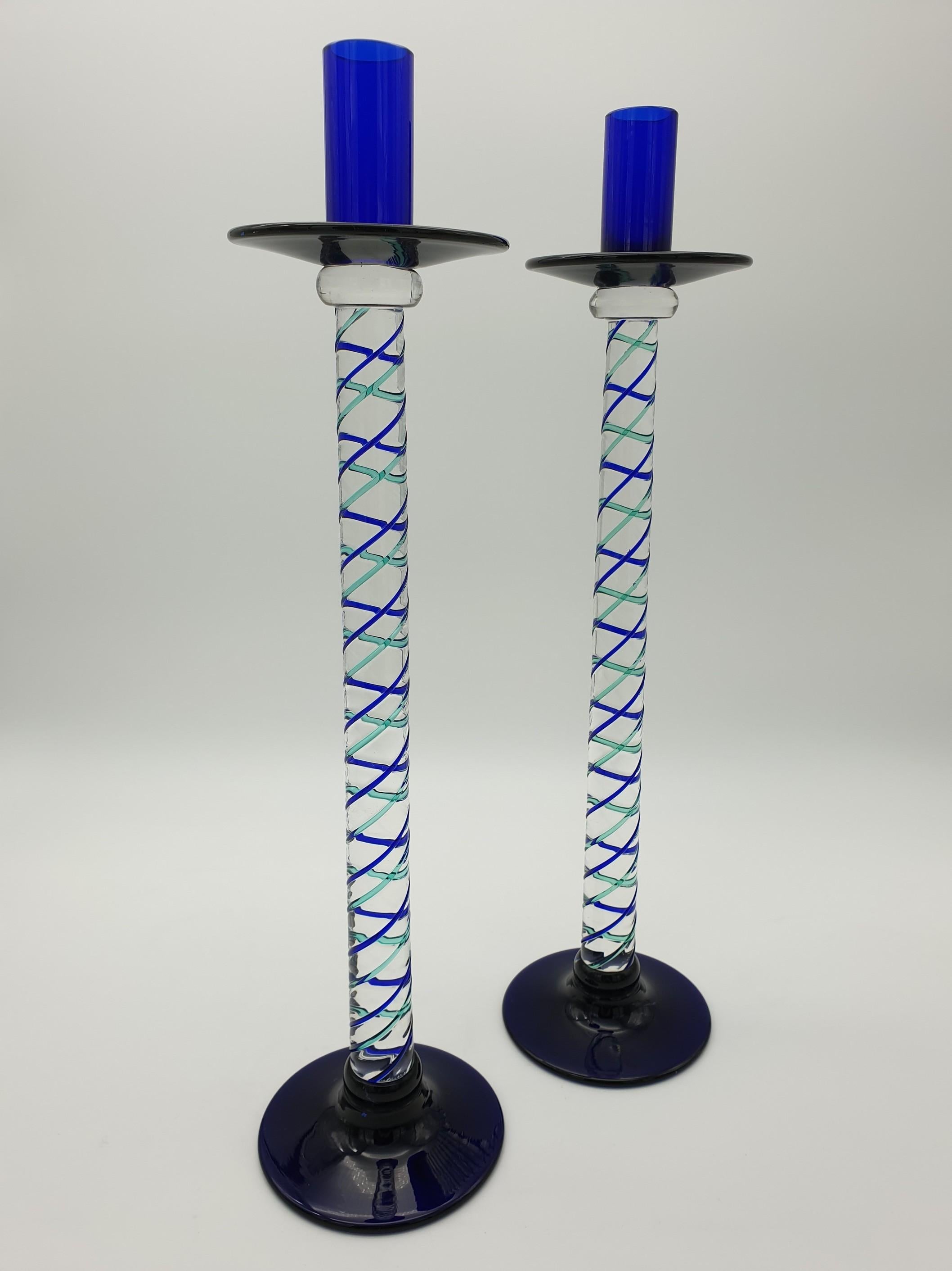 This elegant set of Murano glass candlesticks is a true keepsake of Venice and the reflection of its color on the lagoon. The candlesticks have been mouth-blown and handmade by Gino Cenedese e Filgio in the late 1990s, and the inspiration for their