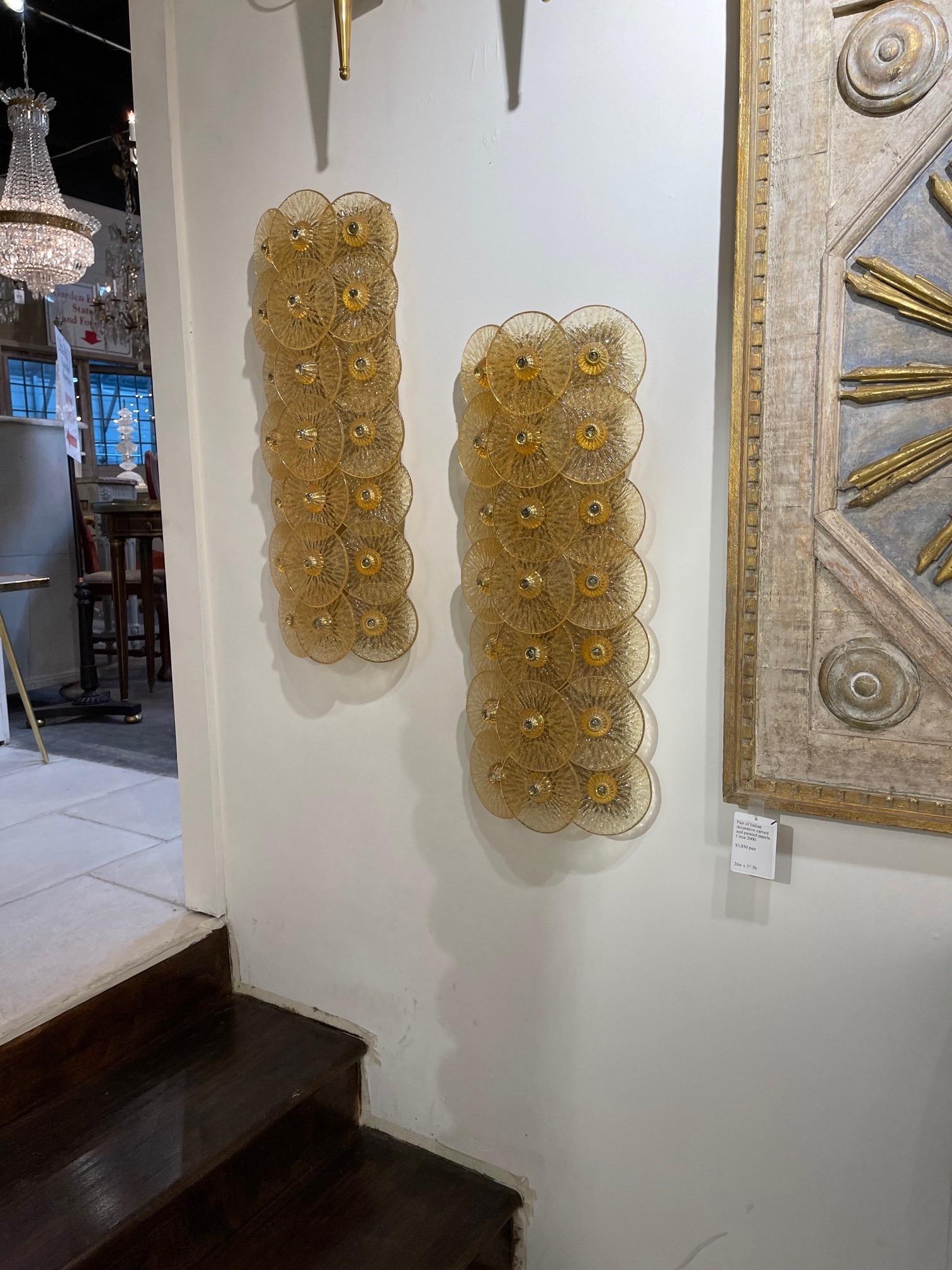 Exquisite pair of modern gold Murano glass disc shaped sconces designed by Carlo Dason. Gorgeous layers of shimmering glass creates a beautiful textural look.