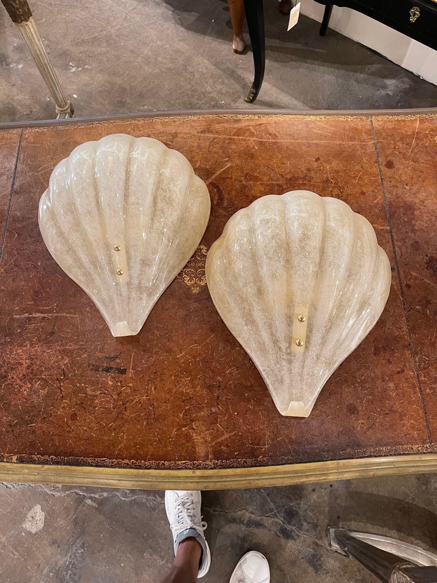 Elegant pair of modern Murano shell form sconces. The color is translucent with touches of gold. Gorgeous for a variety of decors!
