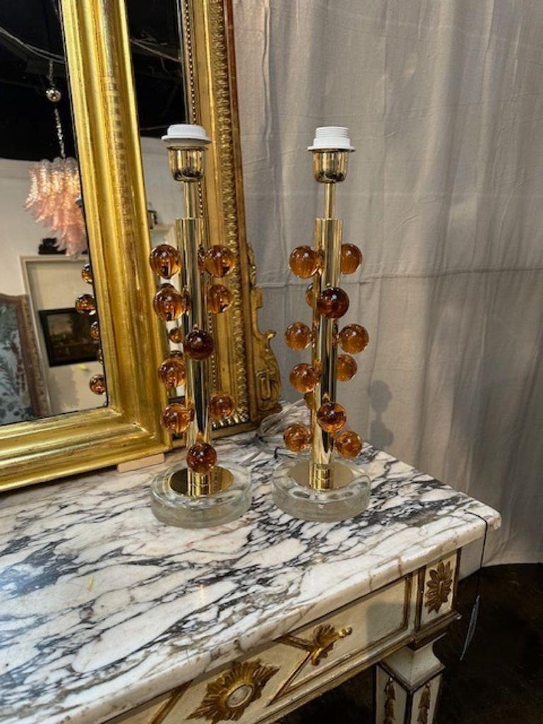 Decorative Peach colored ball form lamps on a brass and lucite base. Creates a designer look! So pretty!