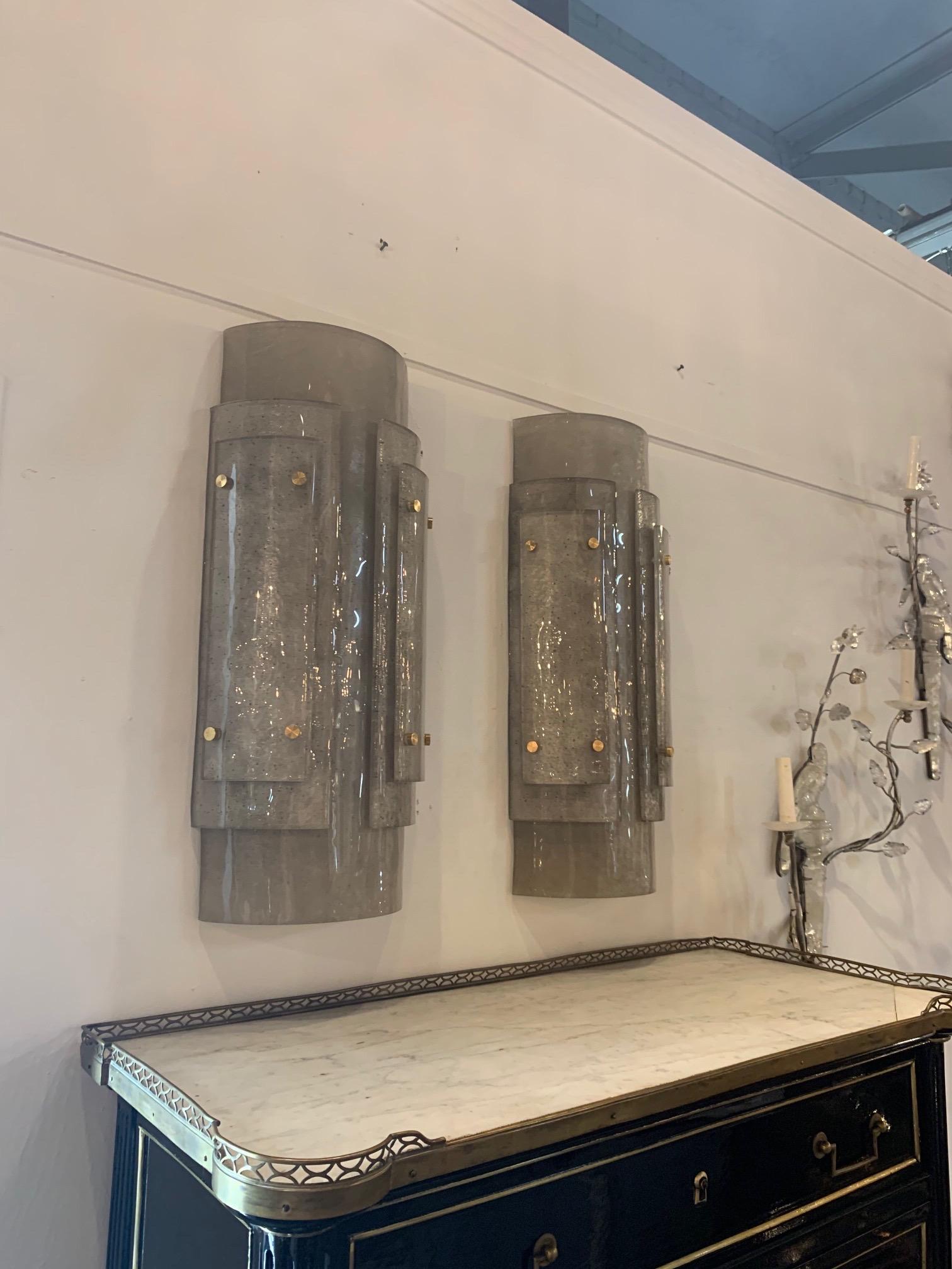 Large exquisite pair of Murano smoke glass and brass wall sconces. Beautiful layers of smoke colored glass creates a very high end look! Exceptional!