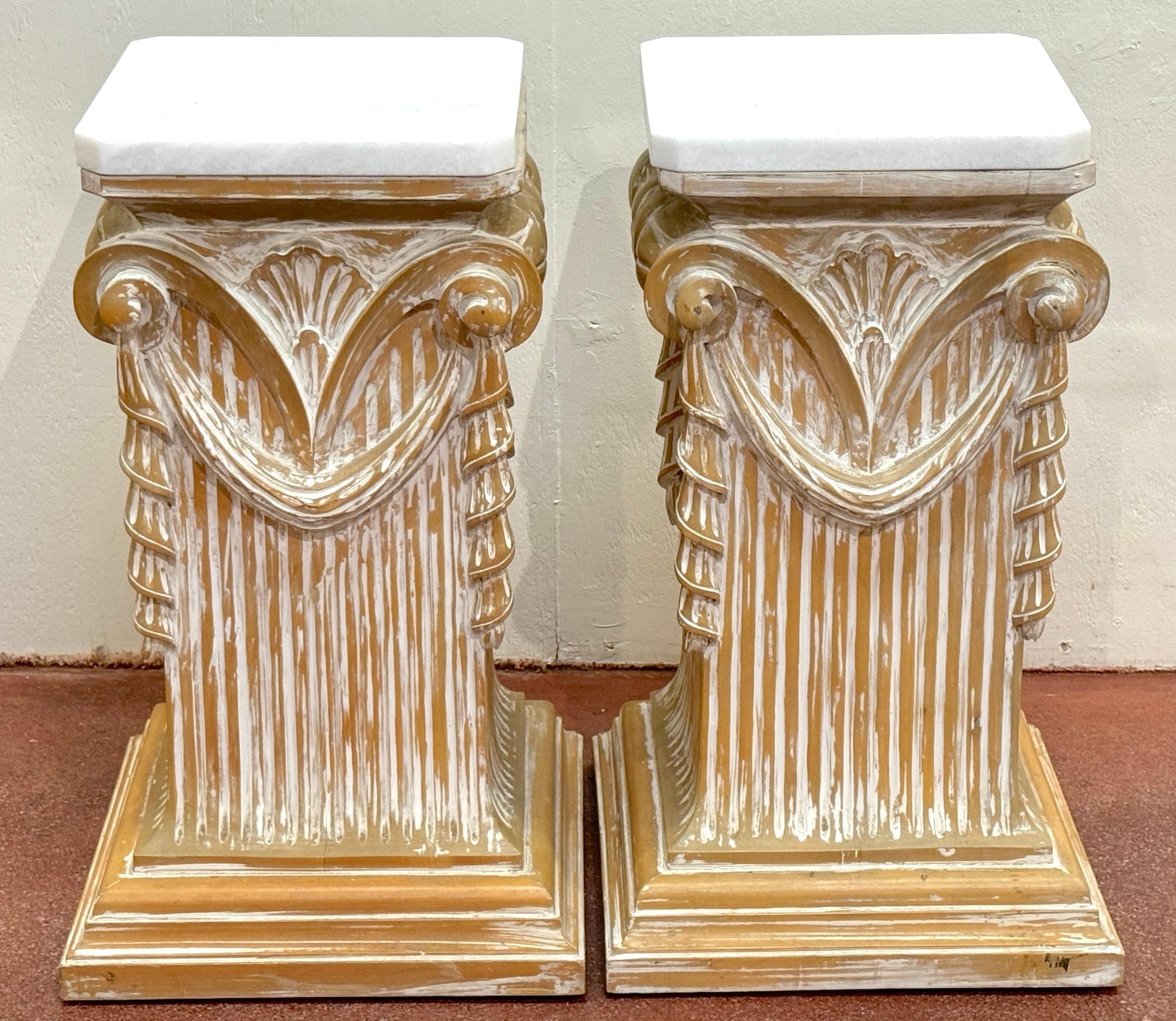 Pair of Modern Neoclassical Carved Wood Whitewashed Marble Pedestals 
Italy, circa 1980s 

A stunning pair of Modern Neoclassical Carved Wood Whitewashed Marble Pedestals from Italy, circa 1980s. These elegant pedestals, each with an octagonal form,