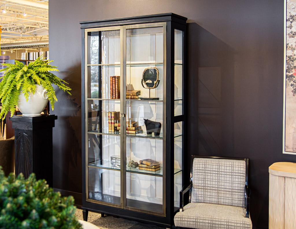 Introducing our new Modern Oak and Brass Bookcase Cabinets, proudly made in the USA. This stunning piece combines sleek design with functionality, making it the perfect addition to any  home. The exterior is crafted with cerused satin black oak,