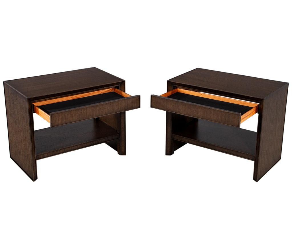 These modern nightstands are the perfect addition to any bedroom. Crafted in the USA, they are made from oak wood and finished in a dark walnut color. The sleek angled design and rich oak wood grains add a touch of sophistication to any room. The