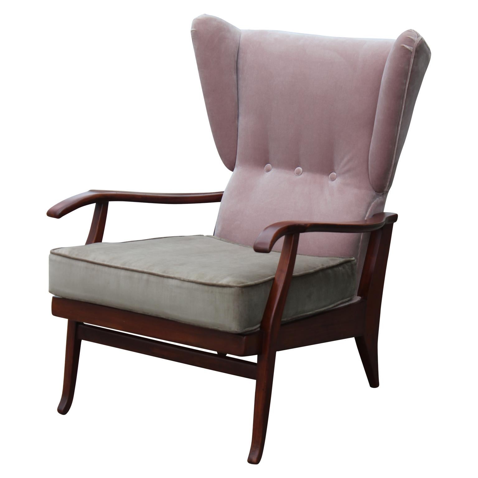 Incredible pair of Paolo Buffa style wingback reclining or adjustable chairs freshly upholstered in dusty pink/mauve velvet with grey/taupe colored cushions. Chairs can be in an upright or reclining position. Walnut wood frames have elegant curved