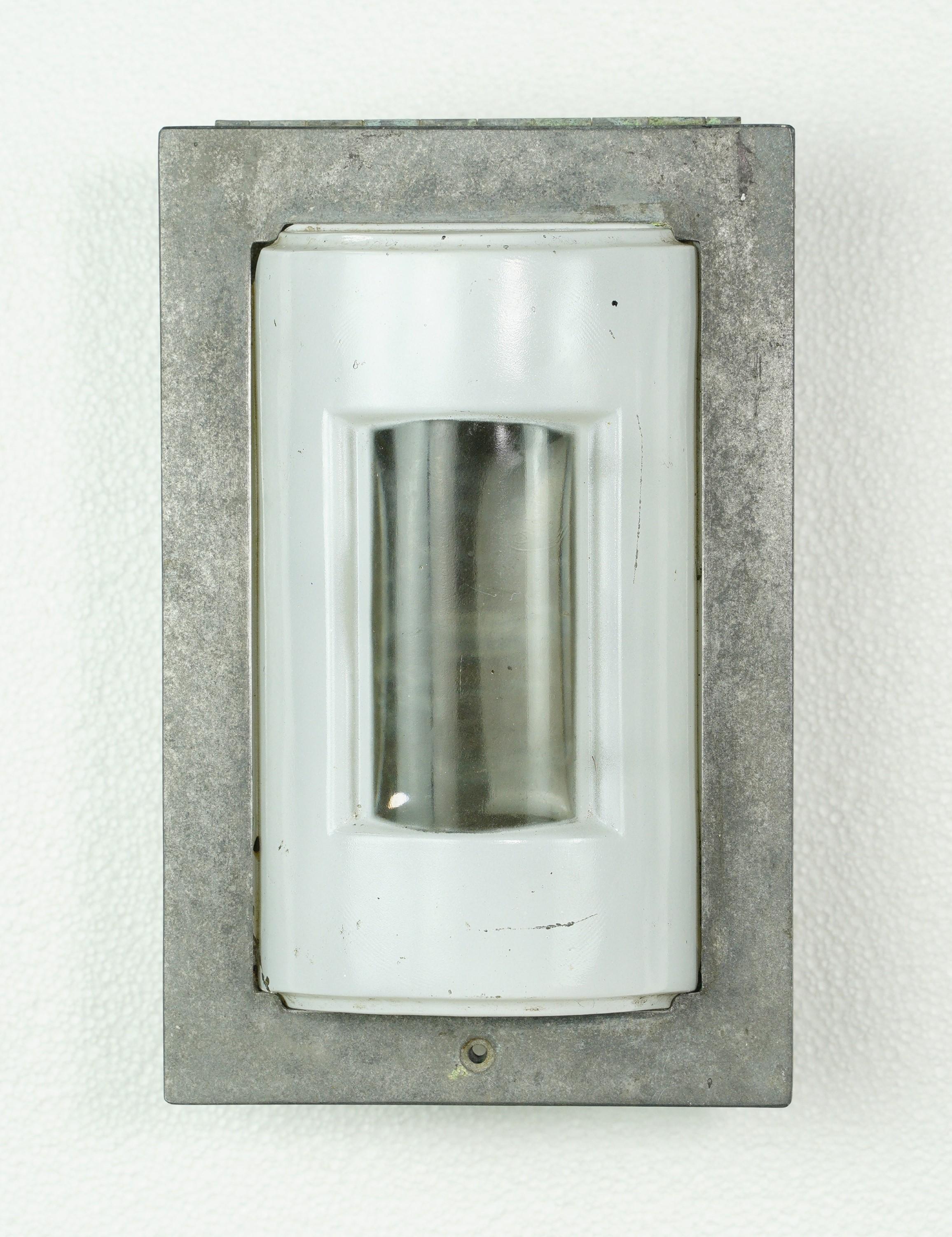 This pair of Modern recessed steel & glass wall sconces exemplify contemporary design, combining sleek steel frames with elegant glass elements. Cleaned and restored. The steel is tarnished, with scratches and blemishes, but the overall condition is