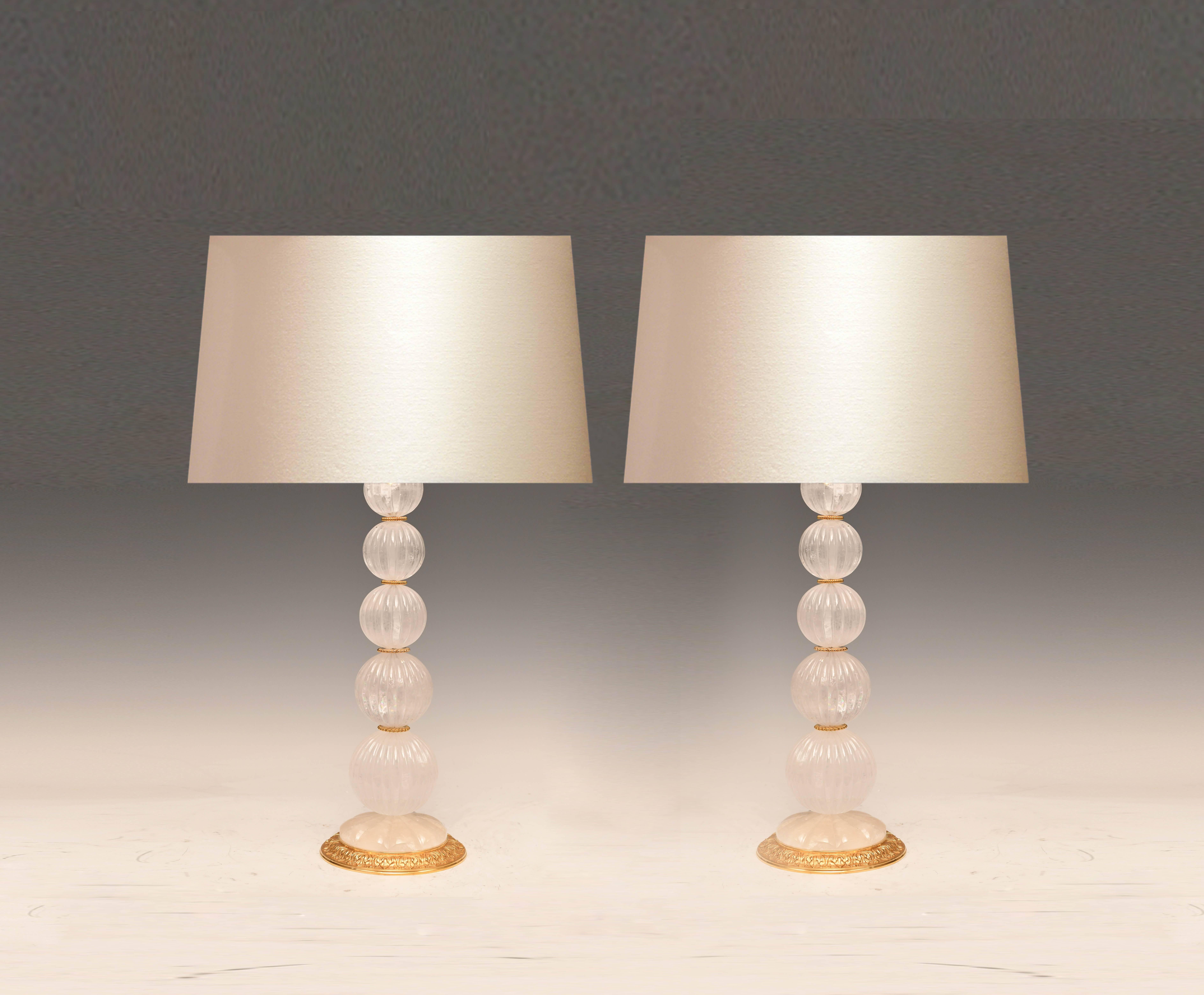 Pair of modern rock crystal quartz lamps with fine cast gilt brass base. Created by Phoenix Gallery NYC.
Measure: To the top of the rock crystal 22