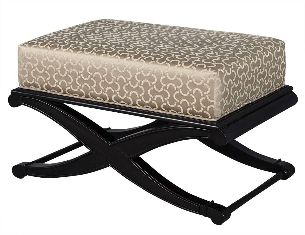 These Modern style ottomans are finely detailed. The base is a deep, satin black and the cushion top is plush and upholstered in a gorgeous fabric. This set is in excellent condition and perfect for a chic home.