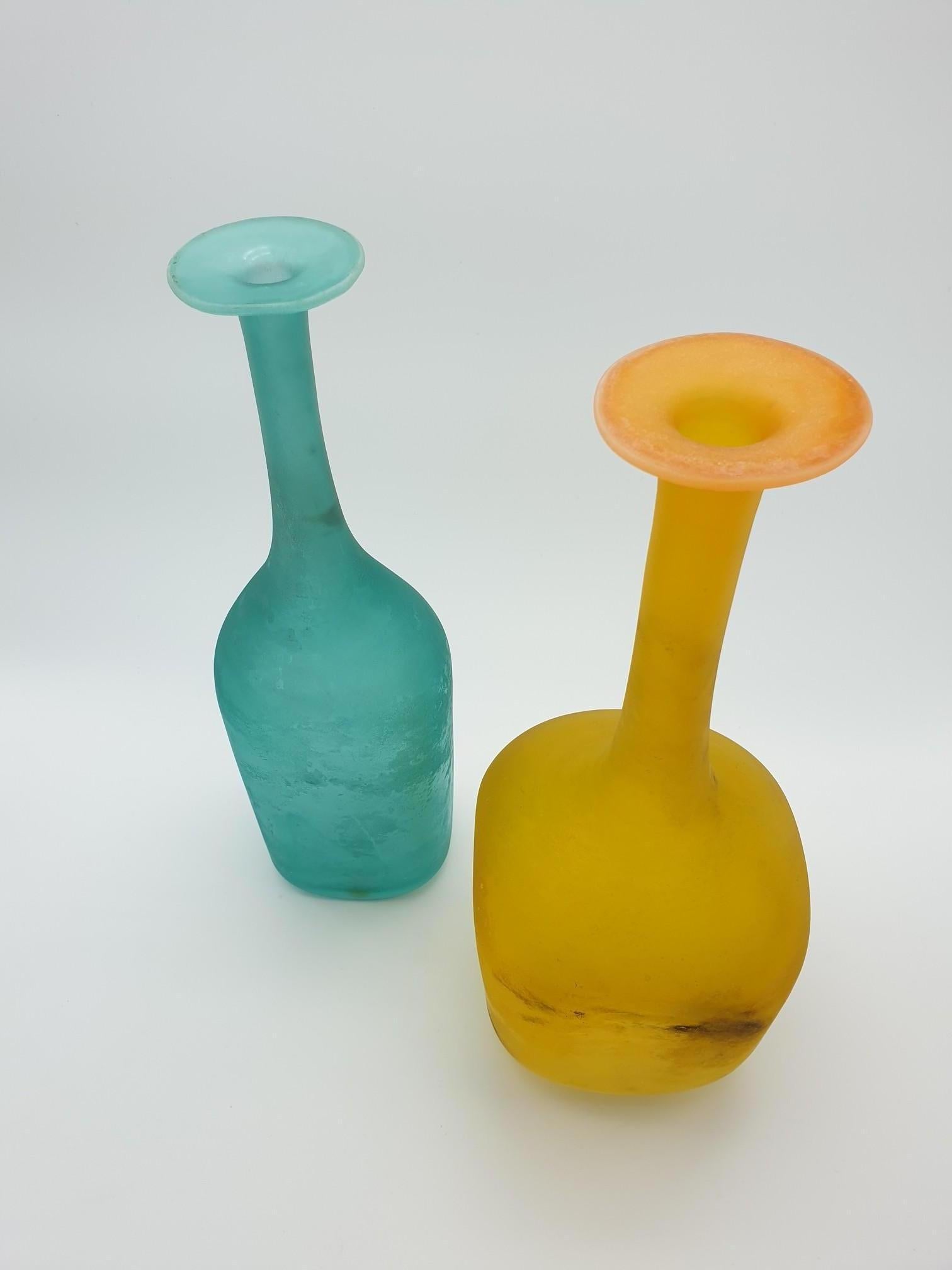 Pair of “scavo” glass bottles completely handmade in Murano by Cenedese. Both pieces feature the “scavo” finish that made Cenedese famous and still distinguish the company production among glass producers. 