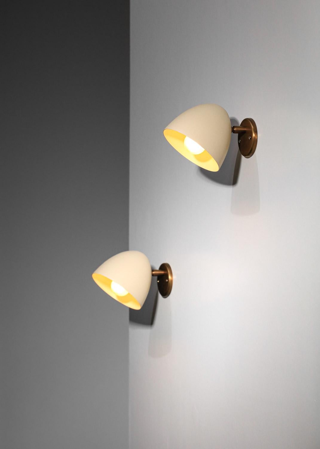 Lacquered Pair of modern sconces by Danke studio  brass and metal For Sale