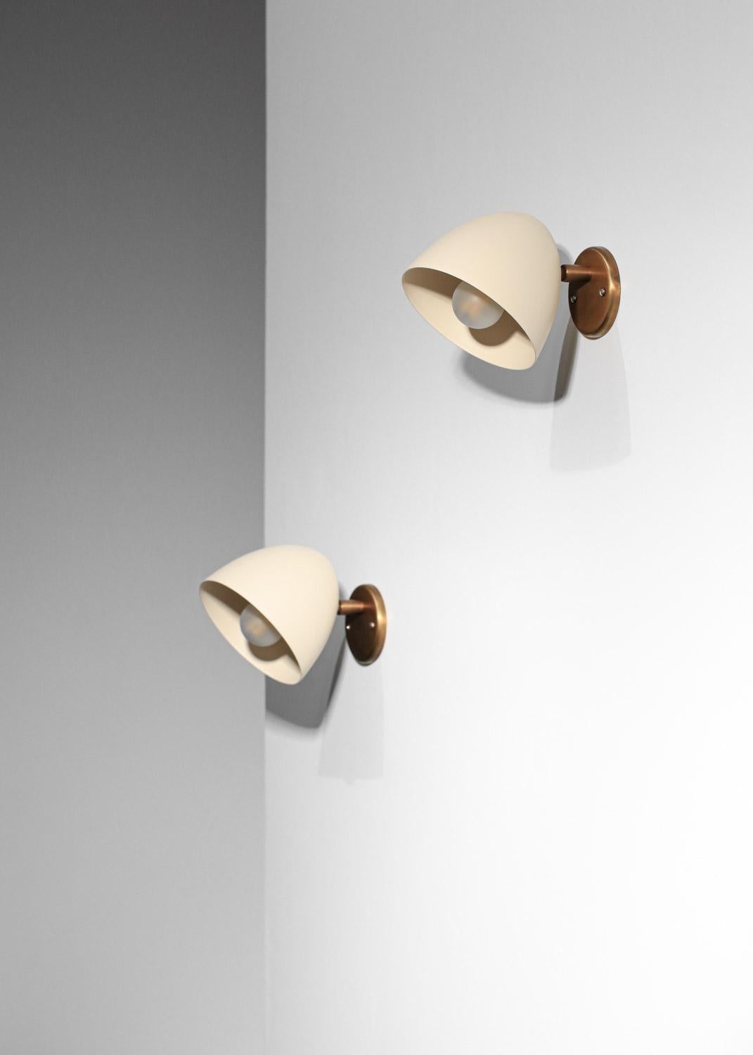 Pair of modern sconces by Danke studio  brass and metal For Sale 1