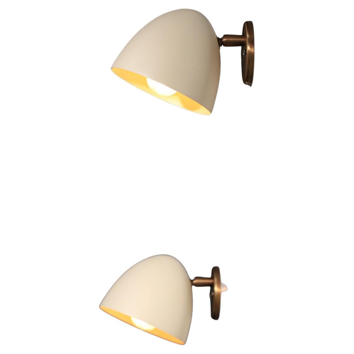 Pair of modern sconces by Danke studio  brass and metal For Sale
