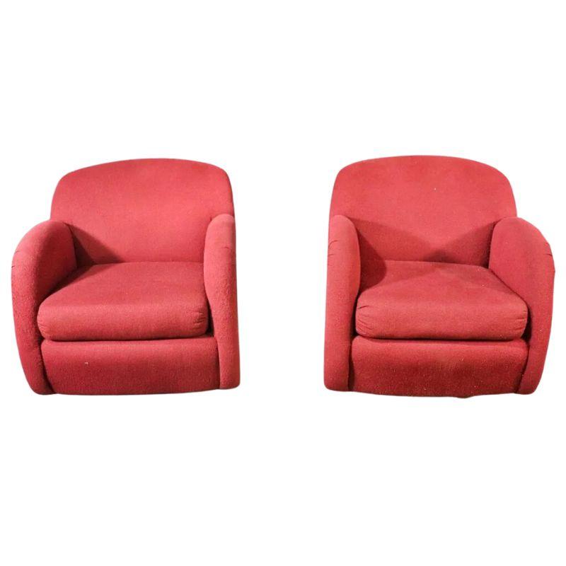 A pair of modern sculptural swivel chairs in Vladimir Kagan style.  Curved back and arms shape the fully upholstered swivel chairs in a contemporary style.  Chairs both rock and swivel on their base.  Fabric shows considerable wear.