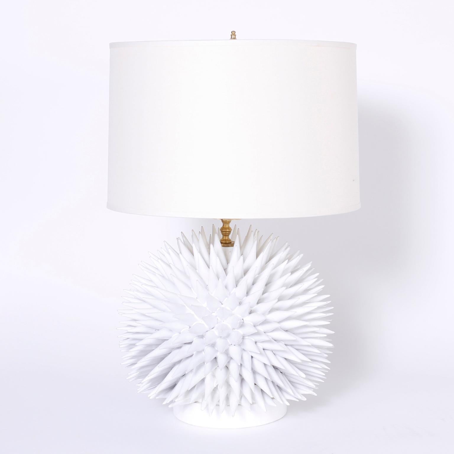 Dramatic pair of table lamps crafted in terracotta, glazed white, and having an elaborate composition resembling a sea urchin.