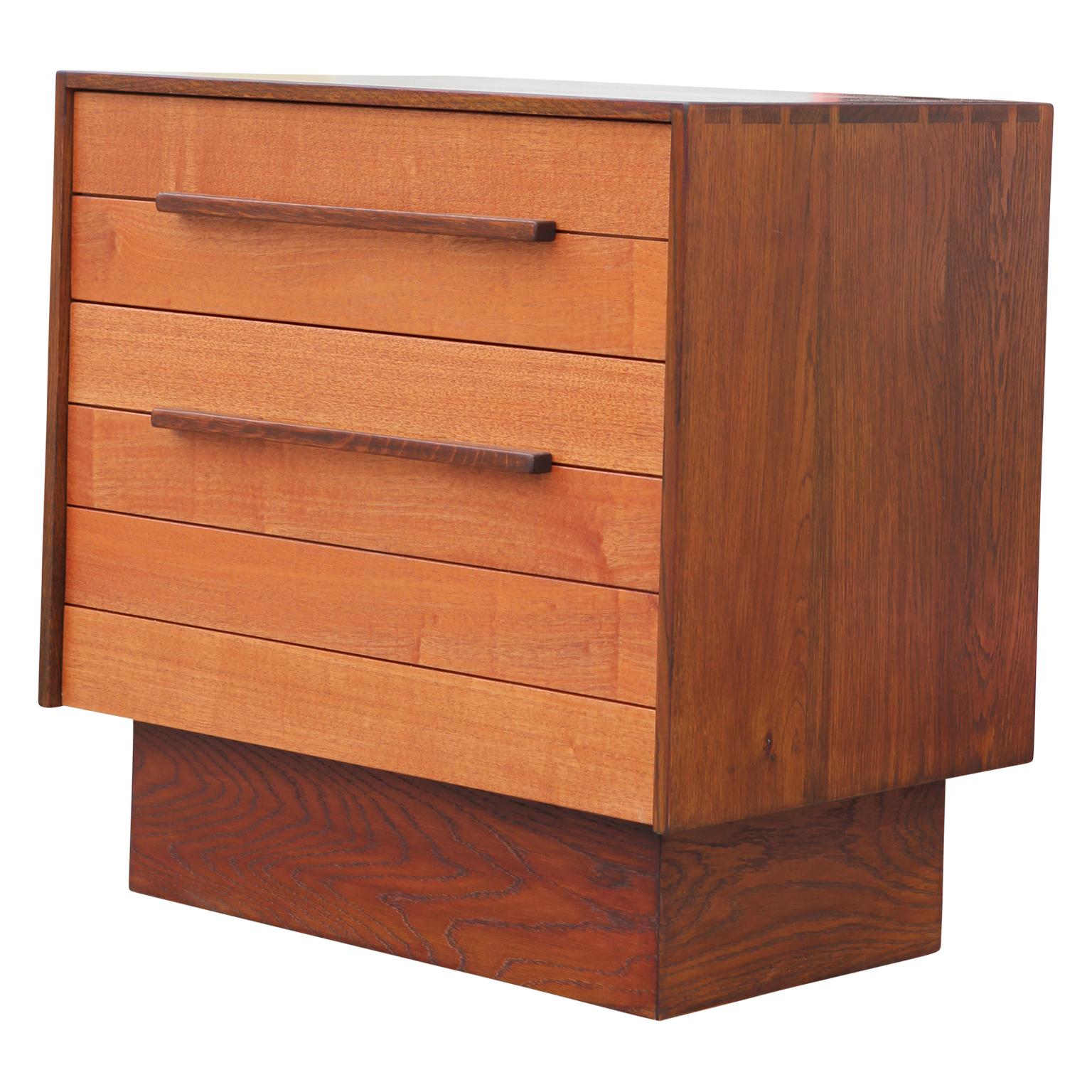 Pair of custom modern norm stoeker two-toned solid wood end table or night stands in a Danish style. The end tables has two pull out / pull-out drawers one large and one smaller. The pieces are handcrafted, studio made with excellency and have a
