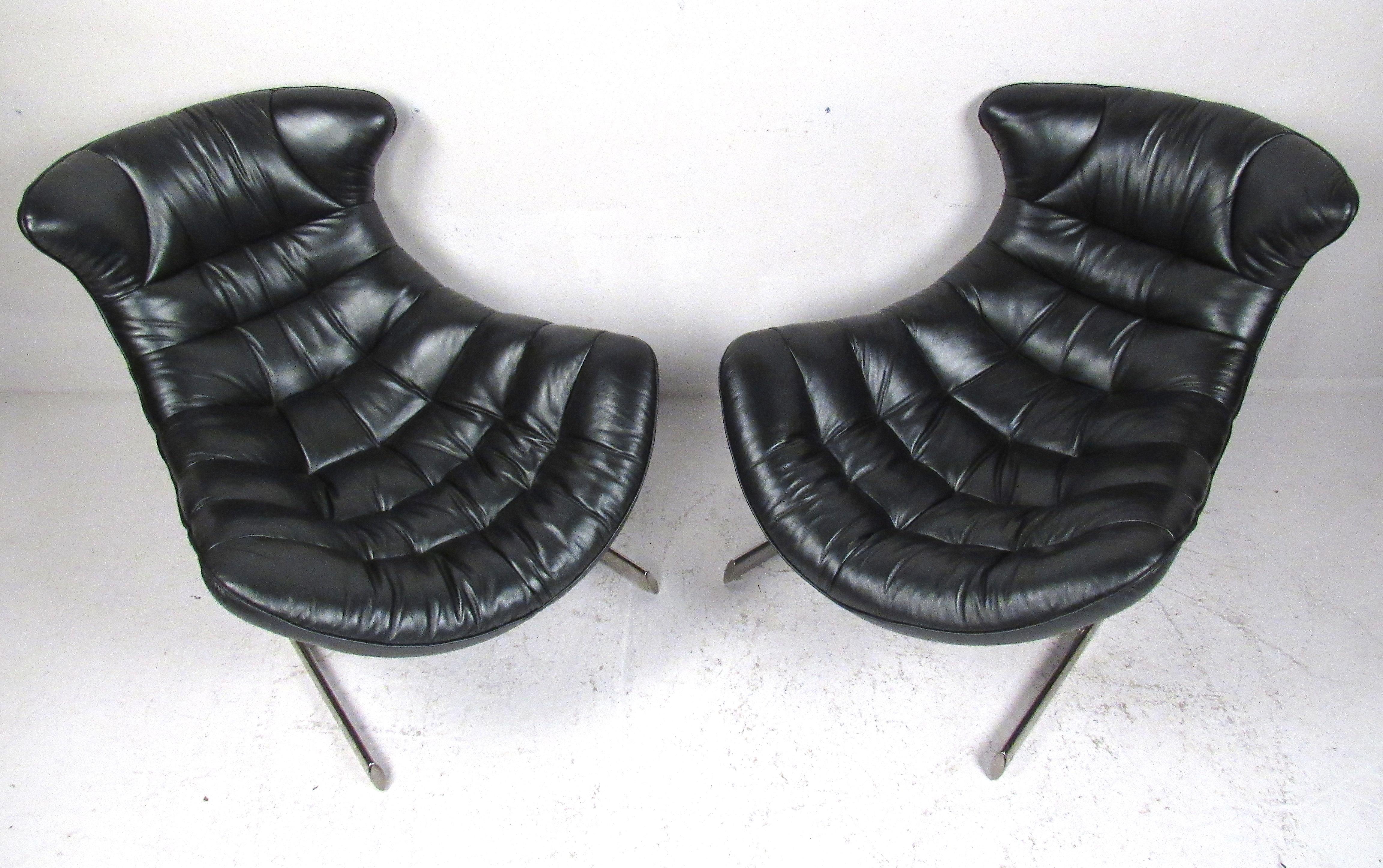 Modern pair of leather lounge chairs with cantilever style stainless steel base. Please confirm item location (NY or NJ) with dealer.
 