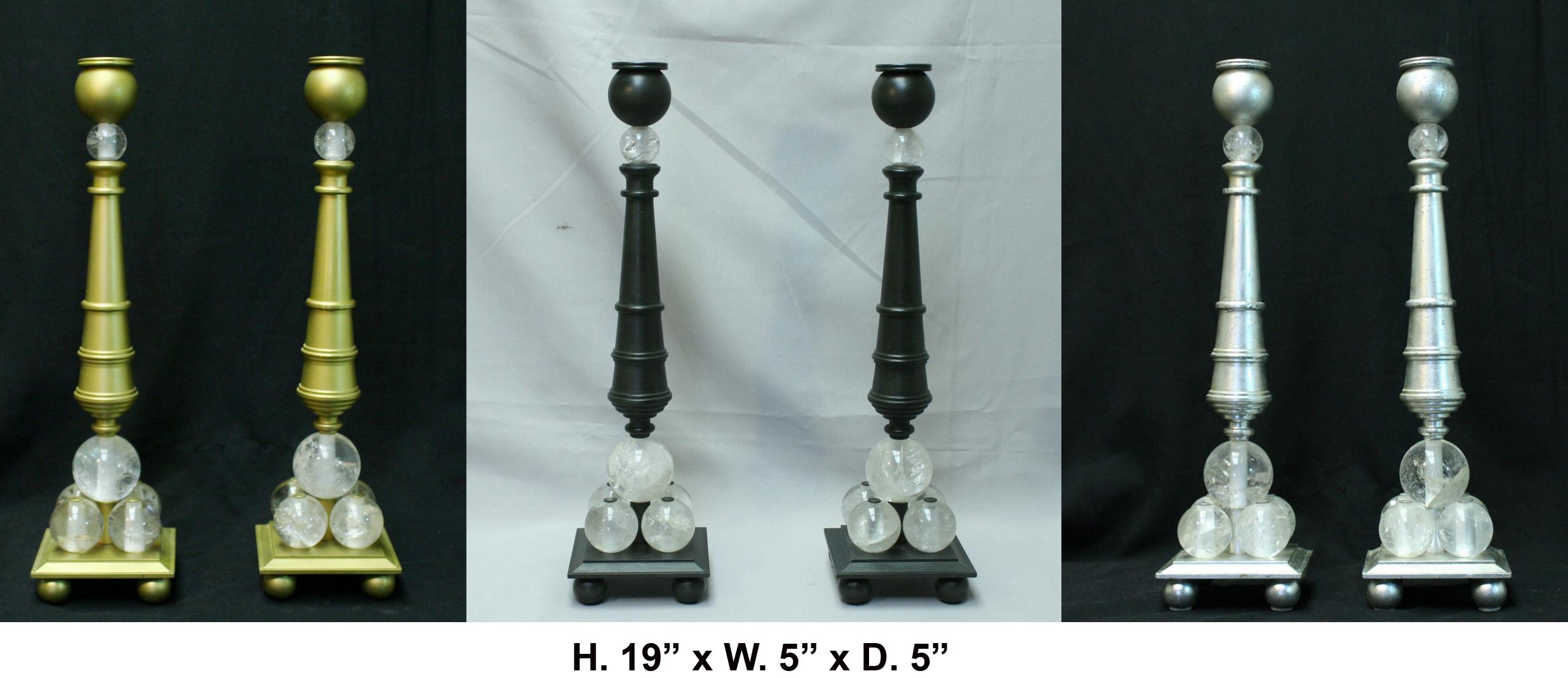 Lovely pair of modern style rock crystal bronze candlesticks. Black finish.
A black bulbous candleholder is over a tapered turned shaft, supported by five hand carved and hand polished Rock Crystal balls, all raised on stepped base with four bronze