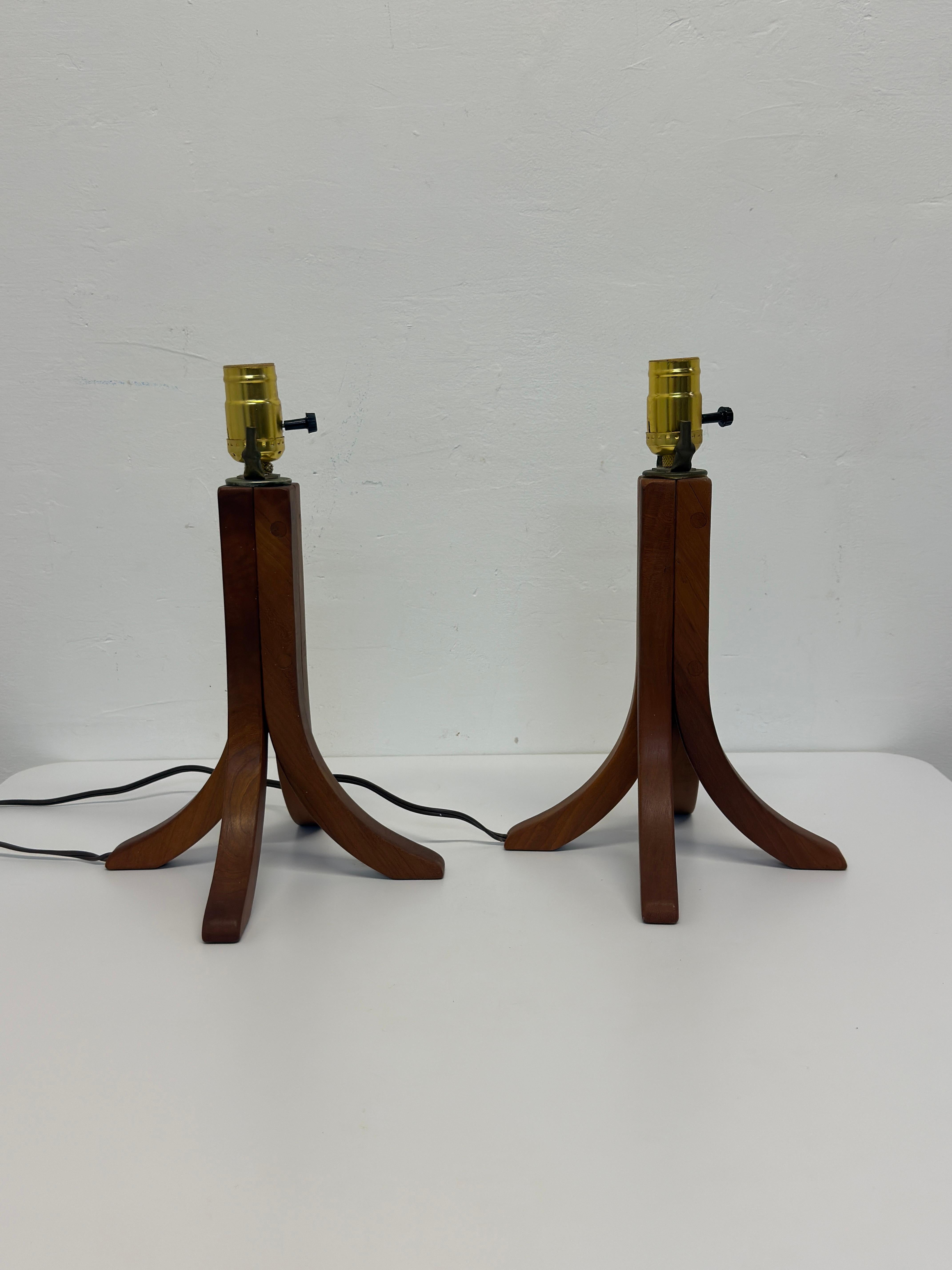 Pair of teak wood table lamps bases.  Signed GB 2003.  Lamps do not come with harp, finial or lampshade. Original wiring works.