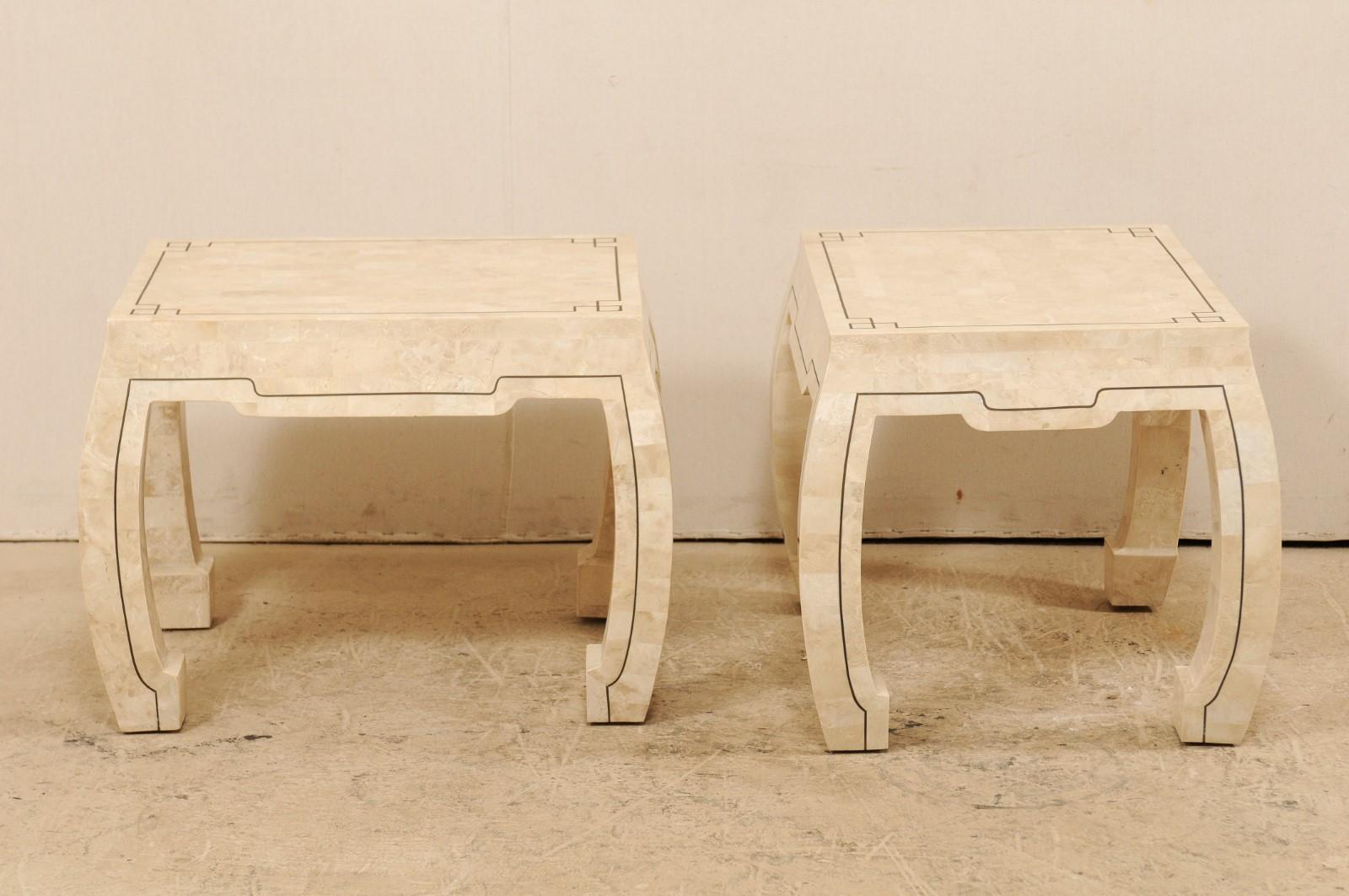 A pair of modern designed side tables attributed to Maitland-Smith, circa 1980s. These vintage tables feature a neutral colored tessellated stone mosaic patterned veneer of rectangular-shaped pieces, each having a slightly different color than the