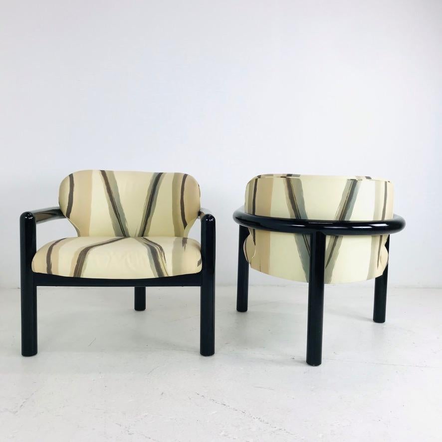 Pair of modern three legged lounge chairs with a black lacquered finish. In good vintage condition with minimal signs of wear, circa 1980s. 
Third chair available as a single.

dimensions: 29