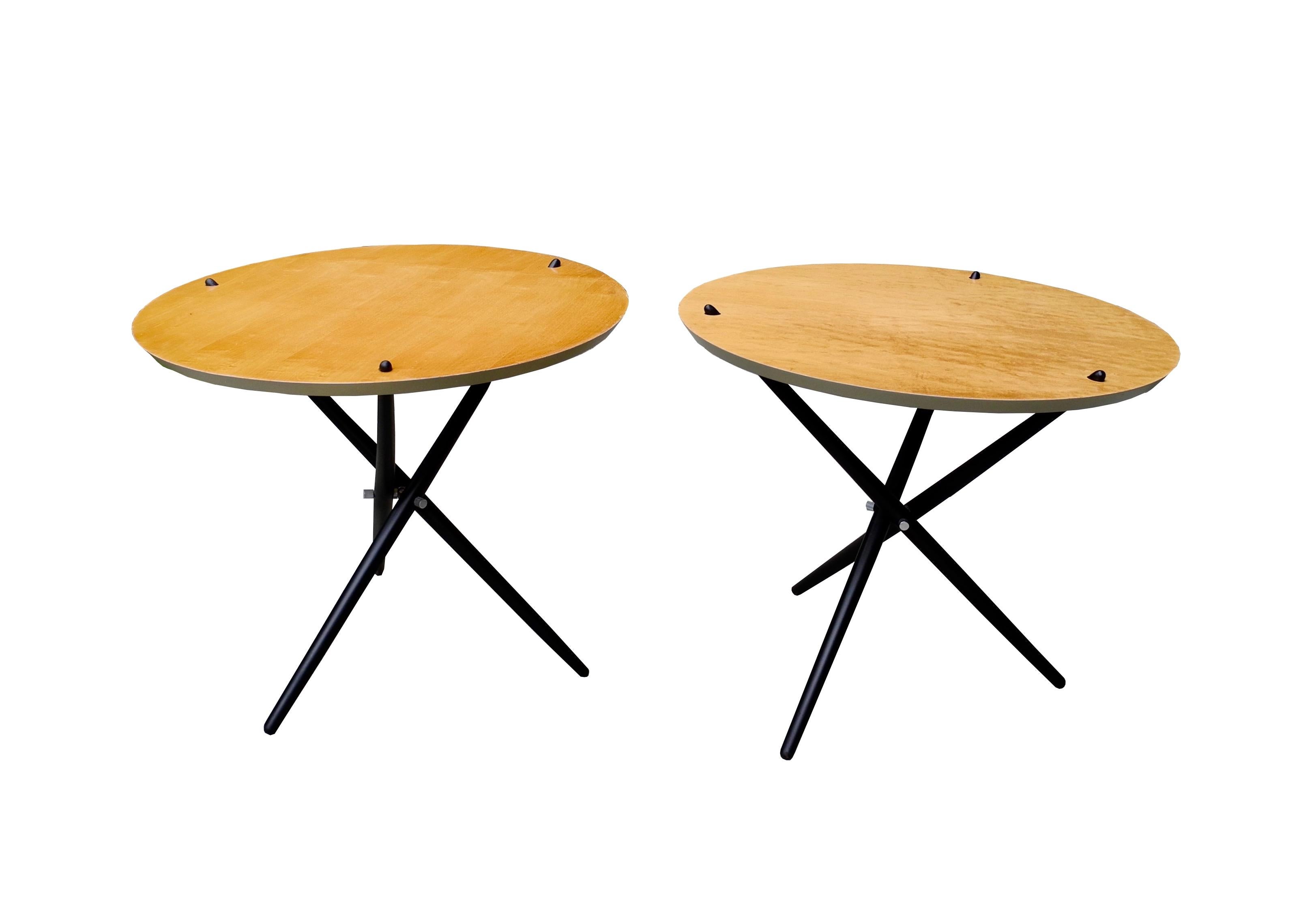 These tripod tables can act as nightstands or side tables. Made of maple and painted wood, the design is signature Hans Bellmann.