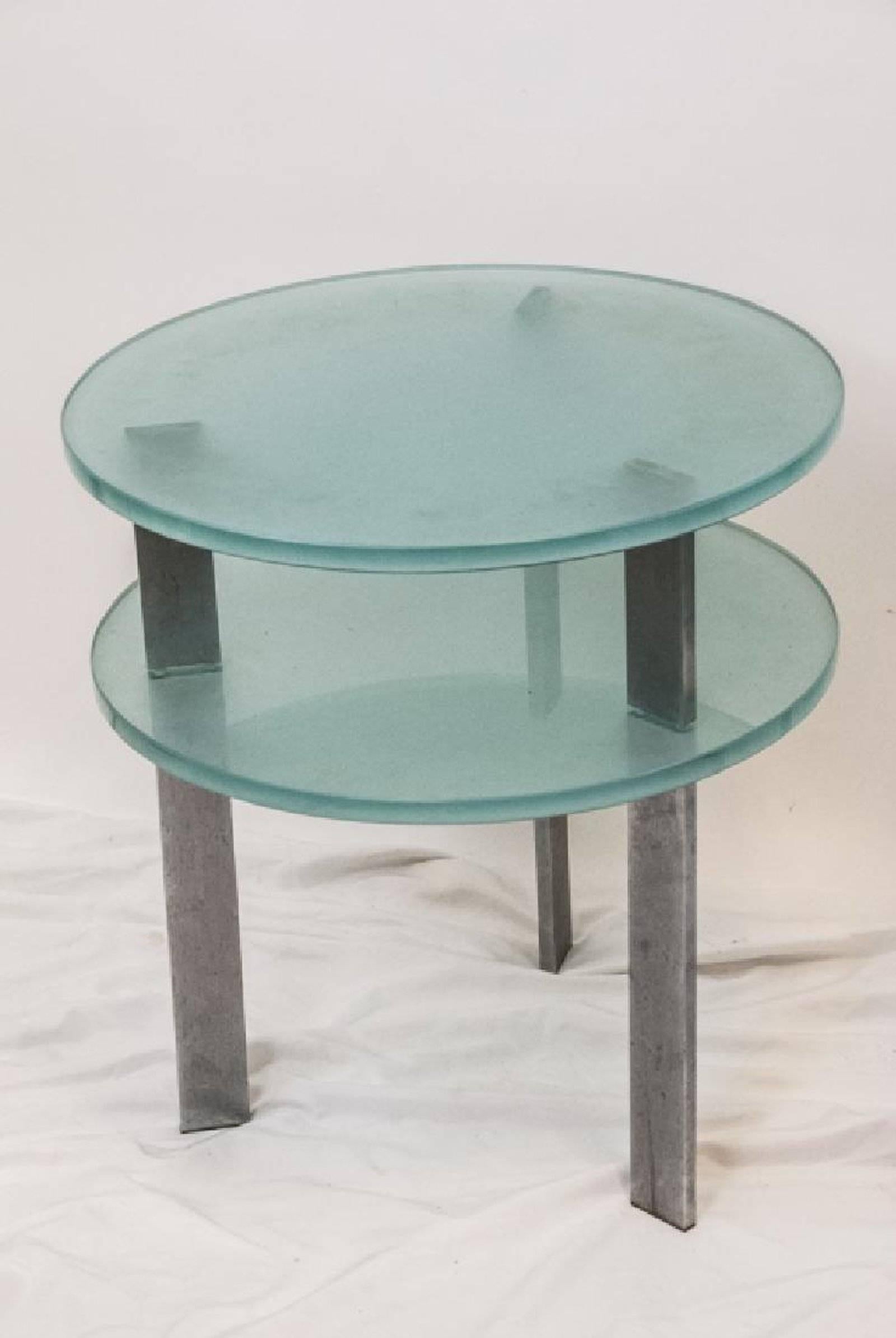 Pair of modern two-tier glass end tables, these tables feature stainless steel and frosted glass. Works well in modern or traditional decor. Can be side tables, end tables or occasional table.